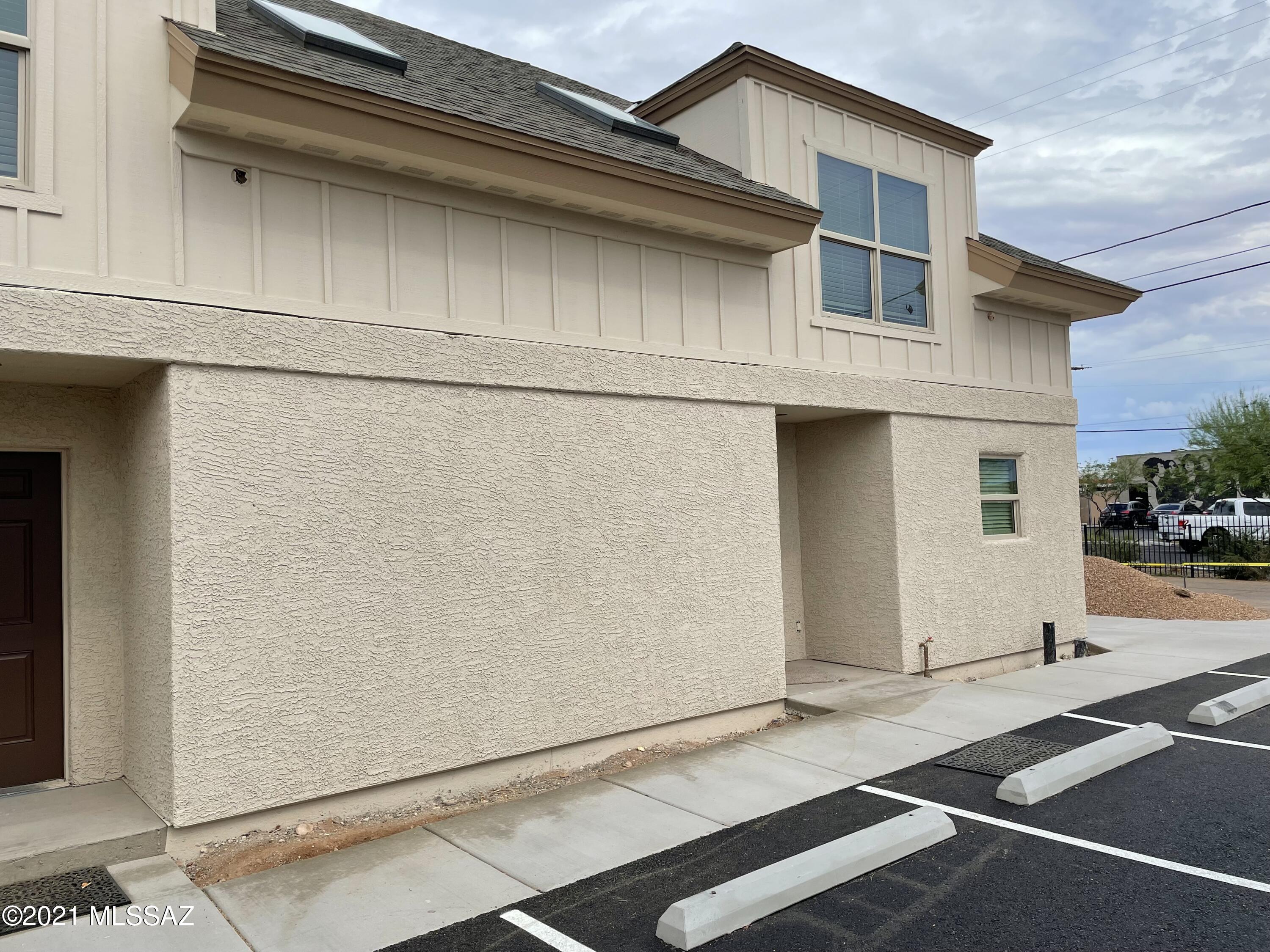 Awesome Centrally located Triplex behind Culinary Dropout! Only 1.5  miles from U of A! Close to restaurants and nightlife. Vinyl plank flooring throughout (except stairs)! Kitchen features  granite countertops, hickory cabinets and stainless steel appliances. Spacious great room with ceiling fan, access to private yard area, and full bedroom and bathroom complete the ground floor. Wander upstairs to 2  additional bedrooms with ceiling fans, each with a private ensuite pedestal sink/toilet. A shared walk in shower separates the areas. Stackable washer and dryer included!!