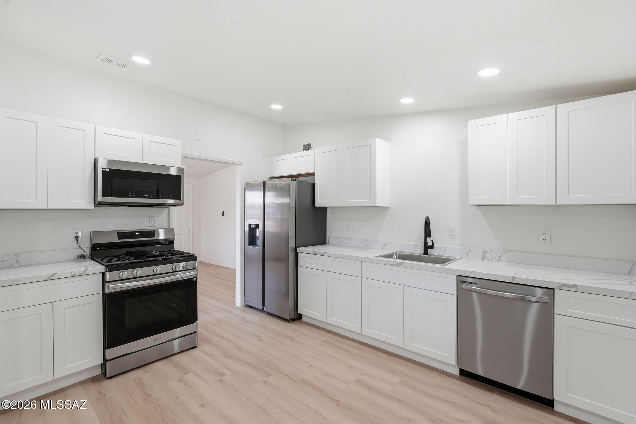 Beautifully remodeled 2-bedroom, 1-bath home in the charming community of San Manuel! This move-in ready home features a completely updated kitchen with stunning quartz countertops, sleek cabinetry, and top-of-the-line Samsung appliances. The gorgeous bathroom has been fully renovated with elegant gold accents, while new flooring throughout adds a fresh, modern feel. Enjoy breathtaking mountain views that surround the property and bring a peaceful charm to everyday living. Whether you're looking for a full-time residence, weekend getaway, or investment opportunity, this stylish home offers comfort, quality, and small-town Arizona beauty all in one package.