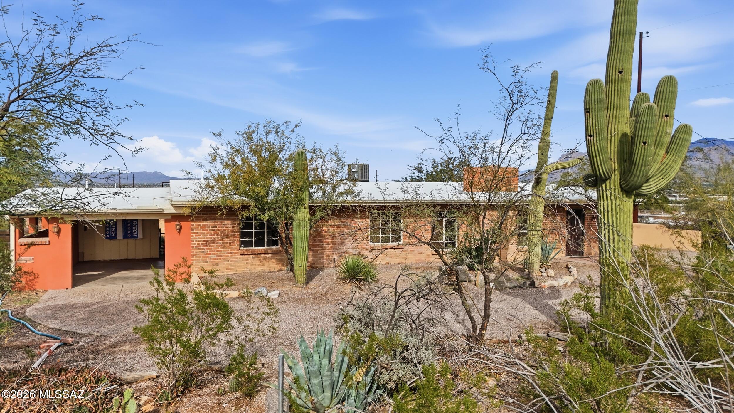 Warm and inviting 3-bedroom, 2-bath ranch home on over 2 acres with durable double-brick construction and a cozy wood-burning fireplace. Enjoy NEW kitchen renovations with modern cabinetry, espresso butcher block countertops, new sink and faucet, dishwasher, gas stove, and microwave. NEW LVP flooring and fresh interior paint throughout, plus a NEW water heater and NEW exterior trim along fascia and windows. An adjacent bonus room offers space for an office, gym, or flex use. The former 2-car garage has been converted into a 572 sq ft art studio. An attached 1-car carport provides covered parking, with a laundry/storage room conveniently located just outside the main living area. No HOA--bring all your toys! Plenty of space for RV parking, and zoning allows for horse property. Outdoor seating features a built-in beehive fireplace and block masonry wall, set within a quiet, natural setting with mature desert landscaping and ideal for nature lovers. Quick access to Interstate 10 offers the perfect blend of rural living and city convenience. Seller reports passive solar heat November through February from four large south-facing windows, shaded by roof overhangs in warmer months. Professional move-out cleaning completed.