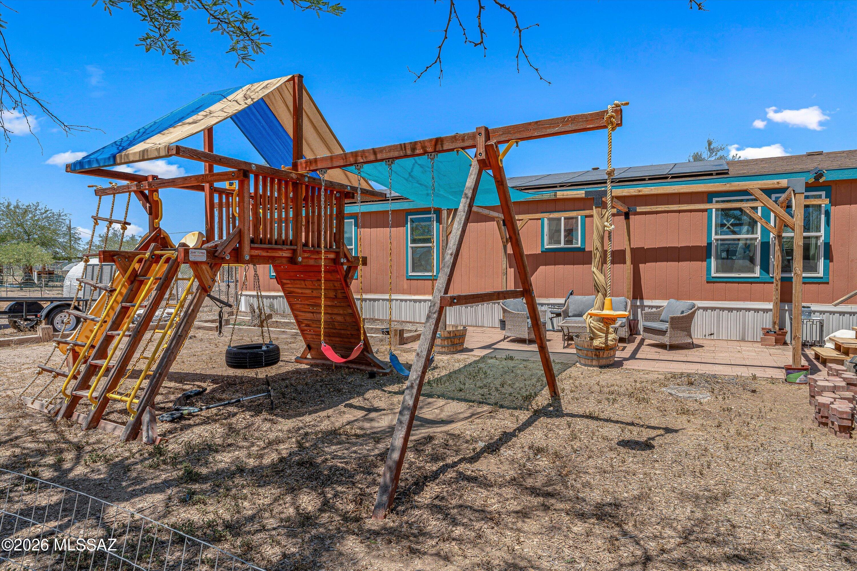 SELLER WILL ACCEPT OR COUNTER OFFERS BETWEEN $285,000 AND $320,000.  Enjoy spacious rural living in this 3-bedroom, 3-bath, 1-acre home with stunning mountain views and no rear neighbors for added privacy. This spacious property features owned solar for energy efficiency and long-term savings. A large circular driveway provides ample parking and easy access, perfect for guests, RVs, or multiple vehicles. The outdoor space includes fenced areas ideal for animals, hobby farming, chickens, or pets, plus a convenient space for an RV (and RV clean-out). With room to roam and upgraded interior features (such as honeycomb kitchen blacksplash), this property offers the perfect blend of comfort, functionality, and scenic surroundings. Don't miss this unique opportunity!