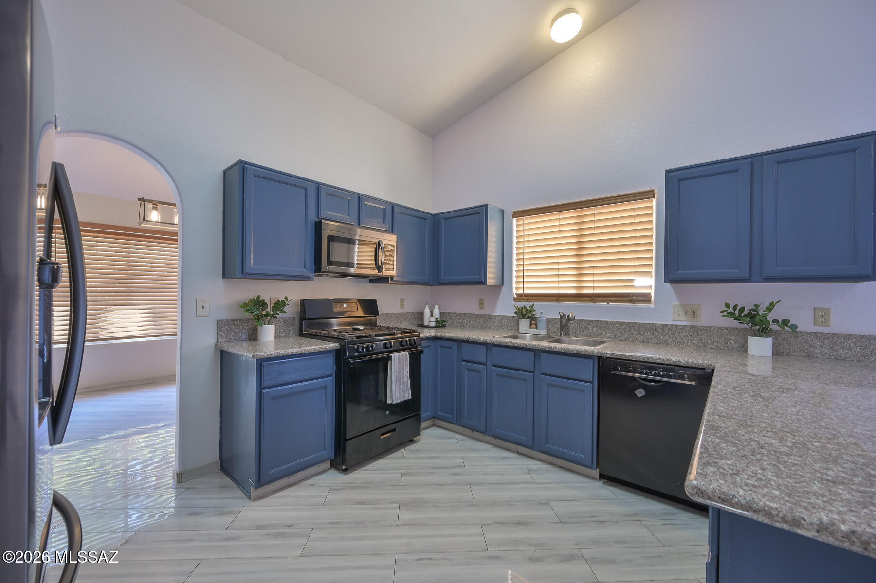 This beautifully maintained 4 bed, 2 bath home in the heart of Rita Ranch, with no HOA, is truly move-in ready! A spacious open layout welcomes you with bright living spaces, perfect for entertaining. The primary suite offers plenty of space, plus a large soaking tub.  The hall bathroom was made by the previous owners to be wheelchair accessible & the doors throughout have been modified to allow for a standard wheelchair as well.  With a freshly painted exterior, brand new turf, newer roof (2021) & HVAC (2023), and all appliances less than a few years old, this house is truly turnkey. Located near top rated Vail schools, parks, and shopping, it has everything you need!