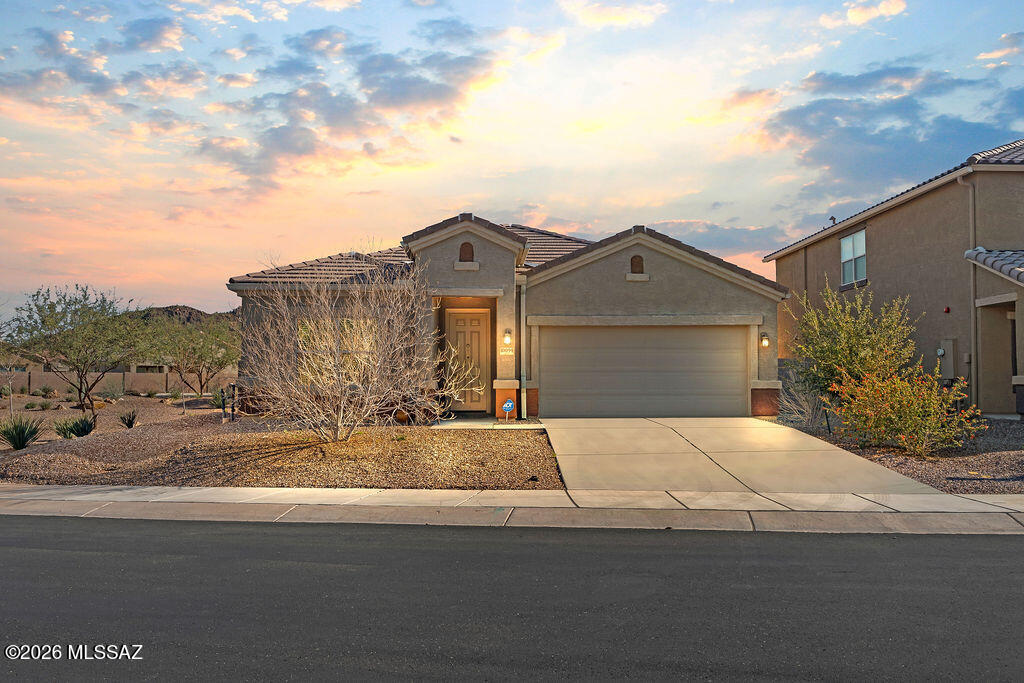 Built in 2022 and located on a premium corner lot, this beautiful 4-bedroom, 3-bath home offers modern living with an open-concept layout, abundant natural light, and contemporary finishes throughout. The spacious kitchen flows seamlessly into the living and dining areas, making it perfect for both everyday living and entertaining. The primary suite features a walk-in closet and a well-appointed ensuite bath.

Enjoy the fully landscaped backyard, ideal for relaxing or hosting guests. Residents also have access to fantastic community amenities including a pool, parks, fitness center, splash pad, and scenic walking trails. Located in desirable Marana, this home offers comfort, convenience, and lifestyle all in one.