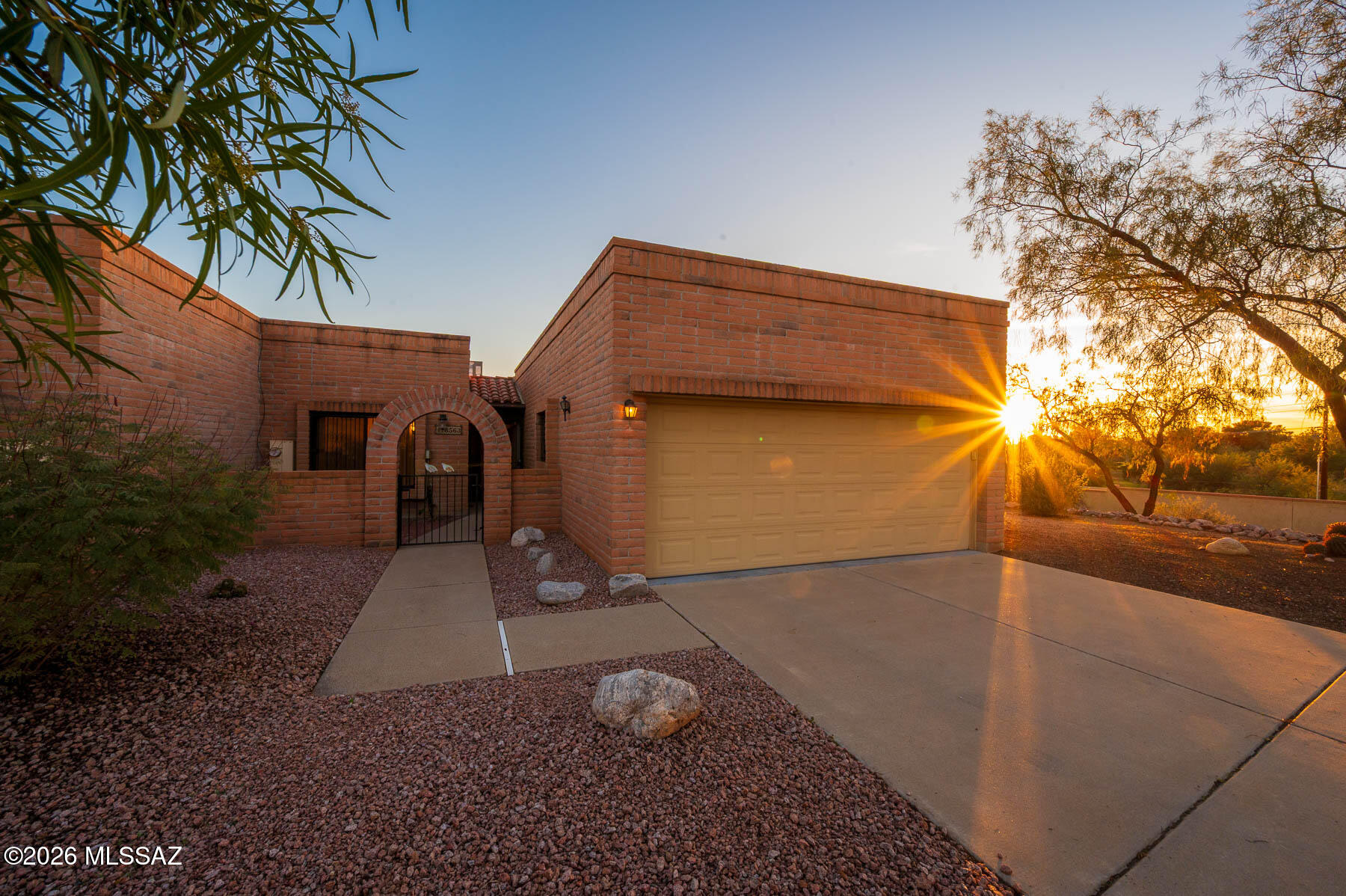 You are invited to this Lovely location high up on a Hill. It captures spectacular mountain vista views, the green golf course across the street and Primo sunsets. You may want to park a chair either on the back patio or side yard to partake in the common Tucsonan past time of weather tracking, be it our famous storms or night sky's. The slump block architectural detail to this age restricted Town-Home community is unknown but was inspired by a visionary and built by Fairfield Homes (see posted history.)  Upon entry there are direct views and easy access from the ''round about'' foyer, to all the rooms. Each room has ''just enough'' space. An immediate right leads to the ultra bright kitchen with a mega skylight, unique slab counter tops, cherry cabinets and table space. The primary bedroom has views and sliding door access to a lovely brick patio with awnings. I must give practical mention to the 2 car garage with extra cabinet storage and epoxy floors. This TH is situated on a street that ends into hillside natural desert, and guest parking, a plus! Can't forget the Foothills Mall being rebuilt down the street with every amenity needed or wanted. Living here is a lifestyle that boasts luxury with a casual ease of living and community amenities.

Venture over to see if this feels like the right place for you. Maybe you can see yourself here, and add the TLC only you can provide.