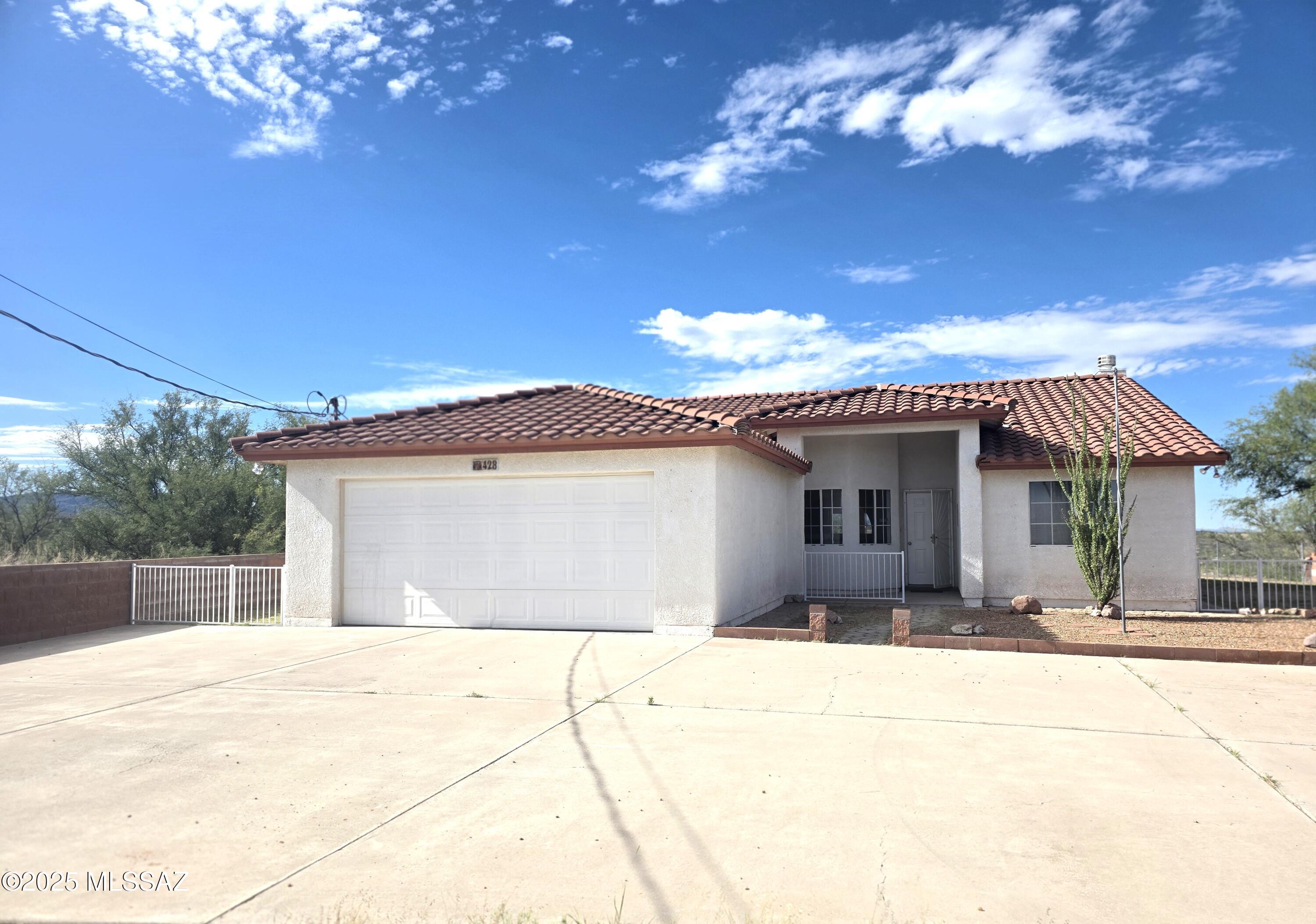 VIEW, VIEWS AND MORE VIEWS.  This home with its mesmerizing views is nestled up high and gives your almost a 360° view.  The property has a second level in the back yard where you can sit and enjoy those wonderful sunsets Rio Rico is known for. Extra land in the property to build a gazebo, pool or any other entertaining area your little heart might desire.  Home already offers an Arizona room for you to enjoy those sunsets or create new memories by hosting the holiday gatherings. Must see to appreciate!!