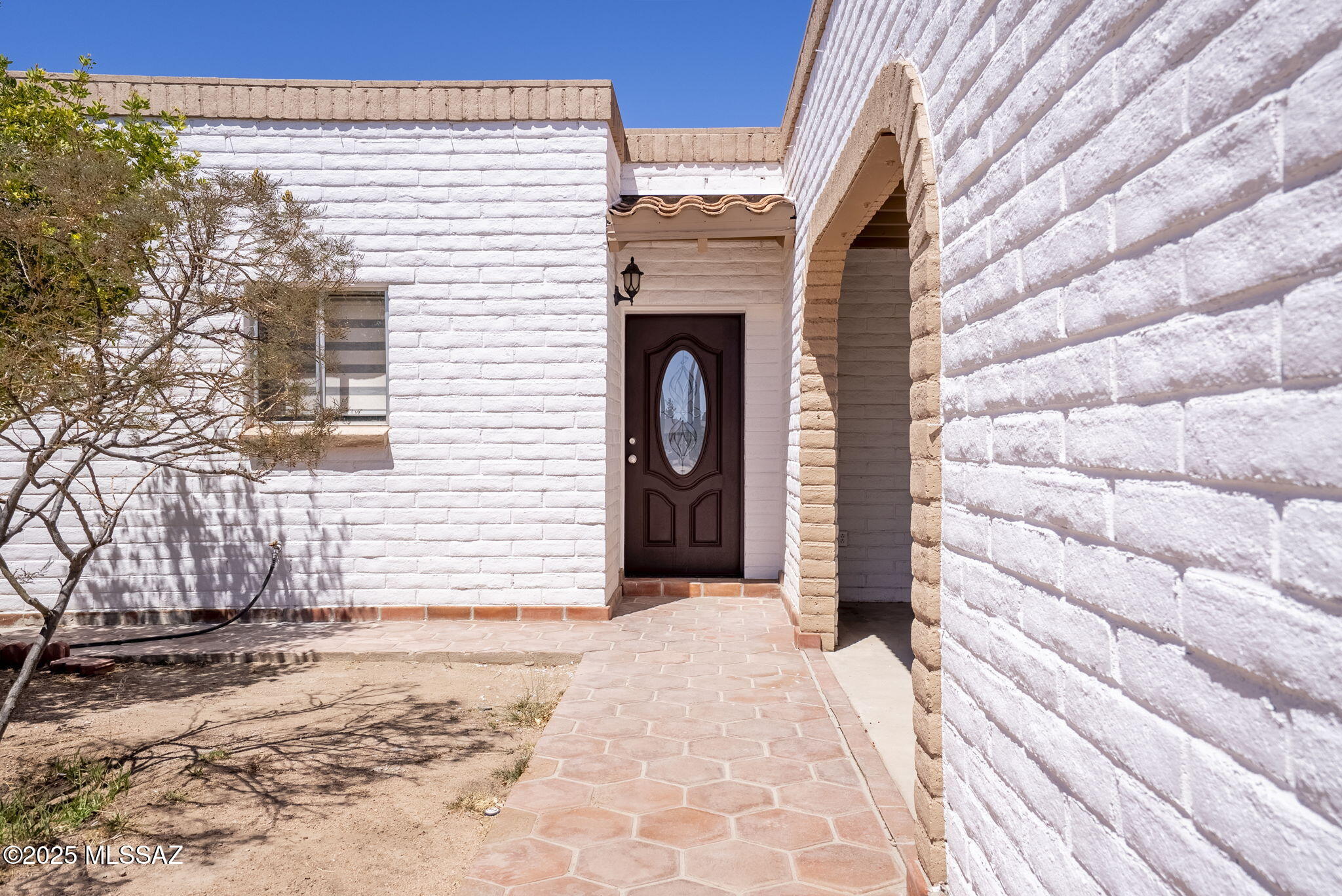 Seize this incredible opportunity to claim this charming 2,750 square foot family home! Upon entering, you'll be welcomed by a spacious living room featuring a cozy fireplace, perfect for those memorable moments. The dining room offers versatility - use it as a traditional dining space or combine it with the living area to create a fun game room! Imagine transforming the bar area into your dream office, or keep it as a social hangout - the choice is yours. The three generously sized bedrooms boast new laminate flooring, adding a fresh touch. Plus, the expansive paved area at the back is ideal for those family gatherings you've been dreaming of, complete with a built-in grill and an inviting space around the fountain to relax and unwind. Don't miss out! Must see in person!