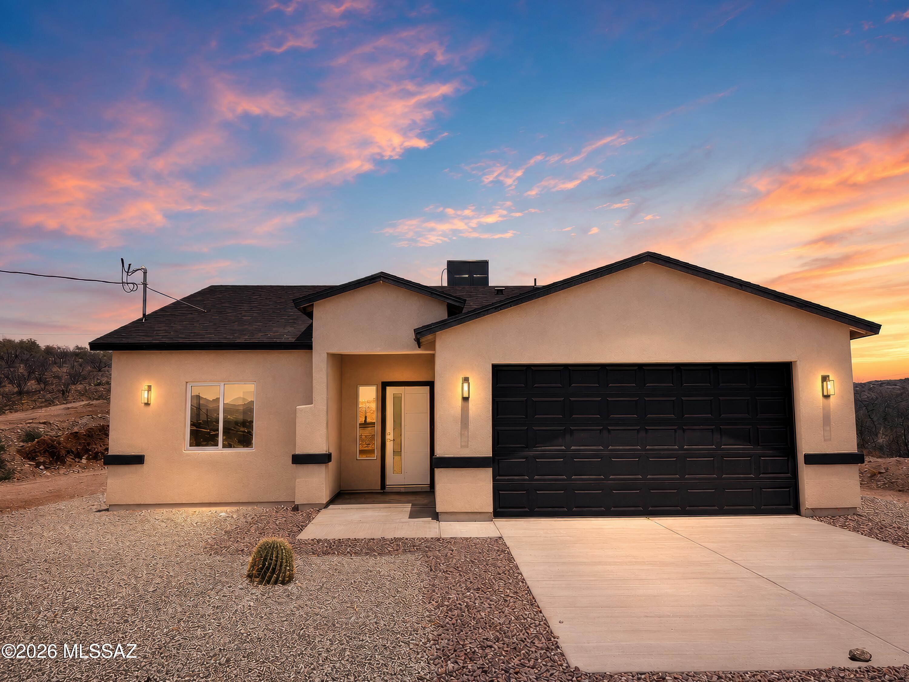 Newly Built 4-Bedroom Home with Stunning Mountain Views in Rio Rico, AZ. This modern, newly built four-bedroom, two-bathroom home offers luxury and elegance with incredible mountain views. The gourmet kitchen features high-end cabinetry in a stunning dual-finished color. This home is situated on 0.49 acres. It blends contemporary design with comfort, making it the perfect retreat in Rio Rico, Arizona.