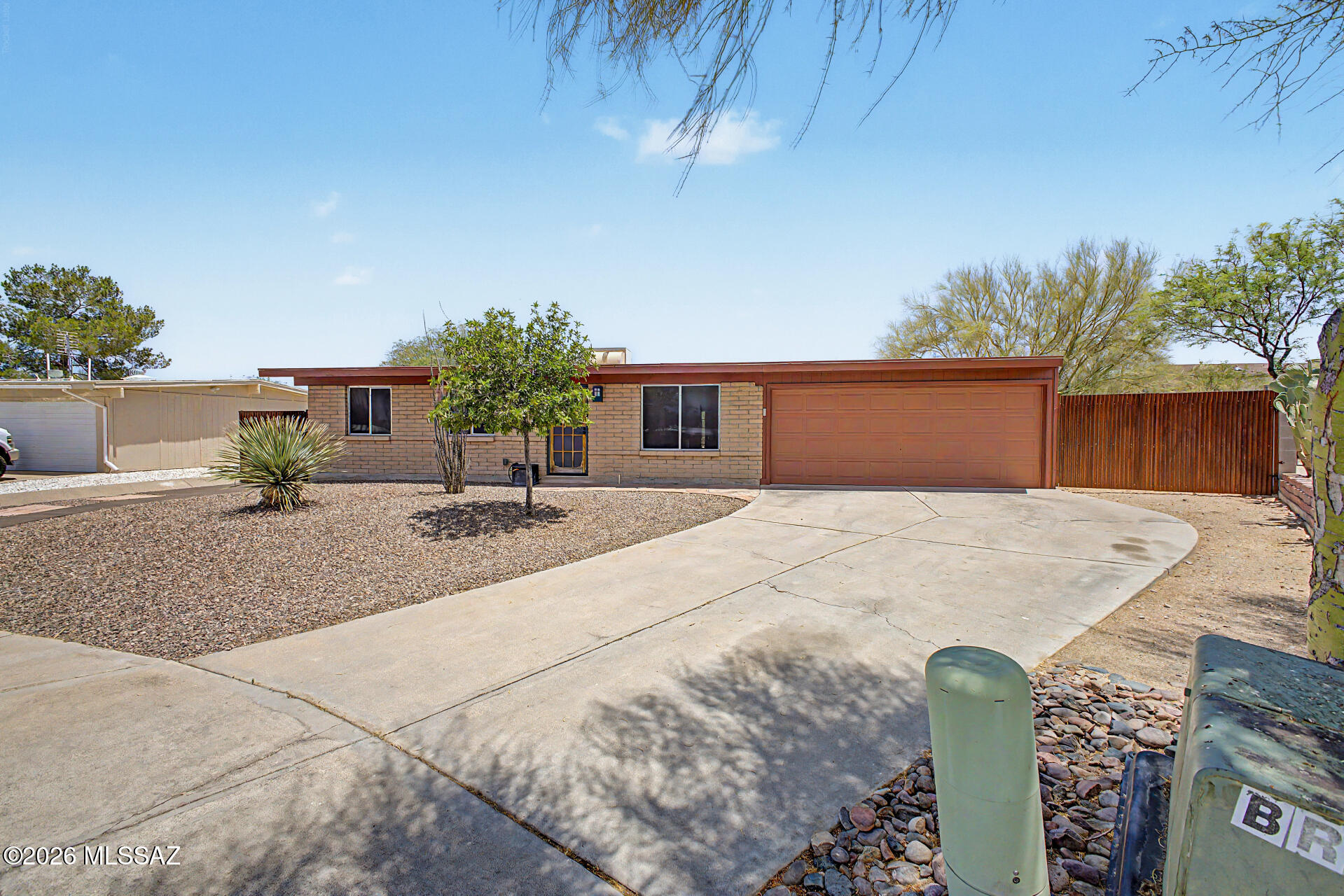 Home Sweet home! One level gem 3-bedroom, 2-bath home tucked away on a quiet cul-de-sac! Great location! This well-maintained property features beautiful curb appeal with low-care desert landscaping and an extended driveway & 2 car garage. Inside, you'll find spacious bedrooms and a functional layout filled with natural light. The large kitchen offers granite countertops, a gas range, and plenty of space for cooking and entertaining or just relaxing after a long day. Recent upgrades include a new HVAC system for added comfort and efficiency. Property setup is ideal for a car enthusiast with additional workspace and storage potential. Enjoy the two side-yard gates providing convenient backyard access along with added flexibility for storage or entertaining,