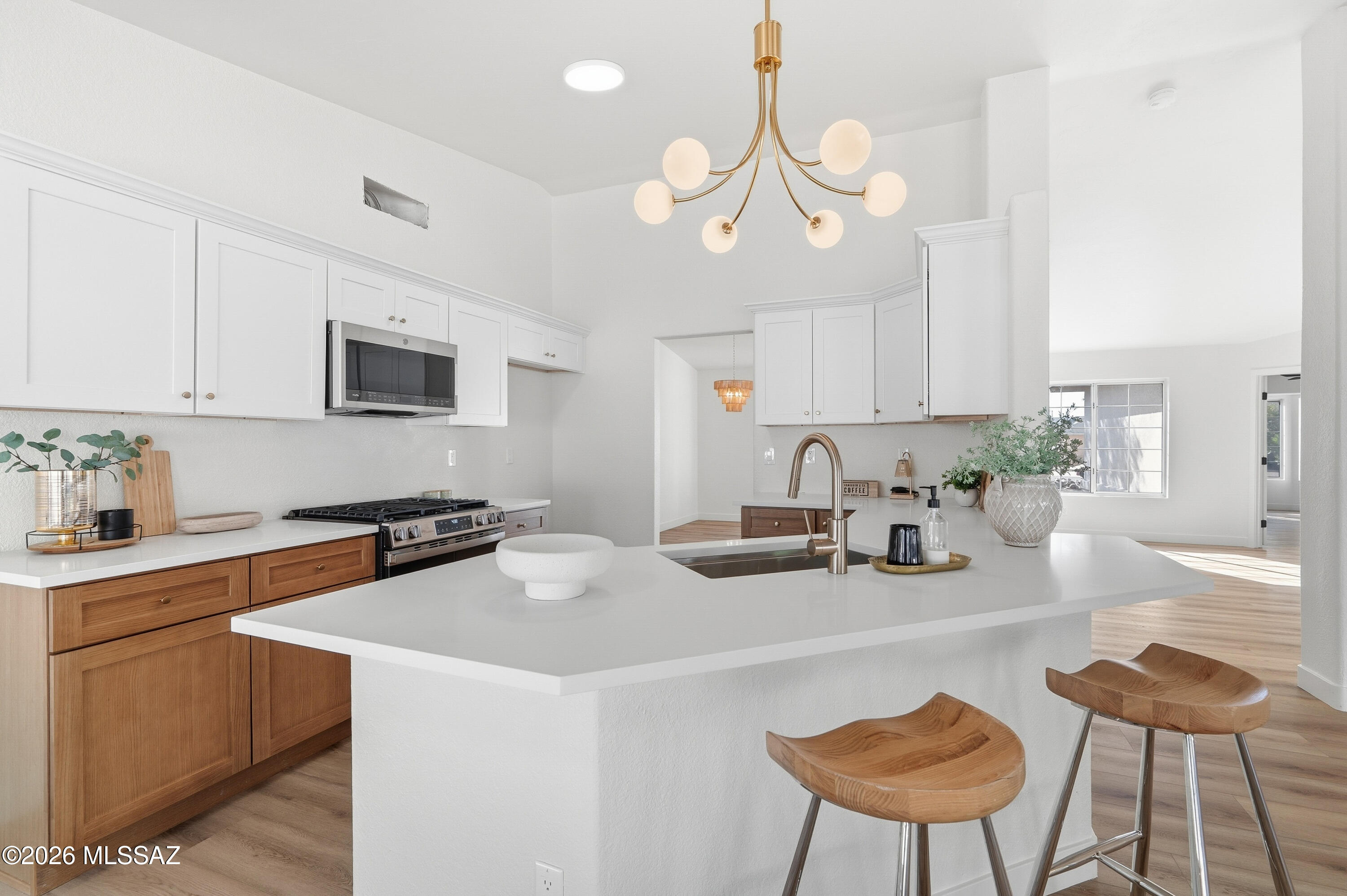 This beautifully remodeled home features new flooring throughout, a gourmet updated kitchen, fully renovated bathrooms, a brand-new roof, and vaulted ceilings. It offers a floor plan you can't find in new construction, plus large front and back yards.