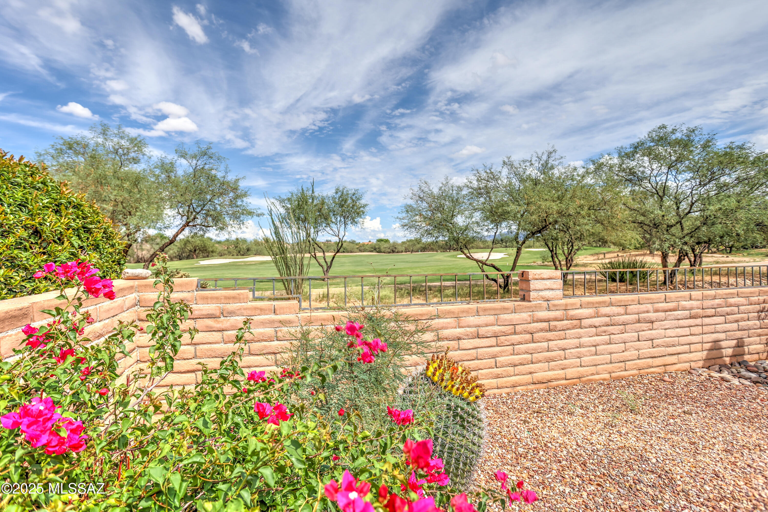 This Cheyenne model embodies Southwest character and charm. Situated on a premium golf course lot with mountain views, this home offers spacious living and timeless Santa Fe appeal. A split floor plan is united by a kitchen which features stainless steel appliances, a gas cooktop, and double ovens. The great room is ideal for entertaining with a wet bar, built-in cabinetry, and a wine rack. A versatile third bedroom features built-in desks and shelving, making it ideal for a home office. Enjoy indoor-outdoor living at its finest in this exceptional desert retreat.