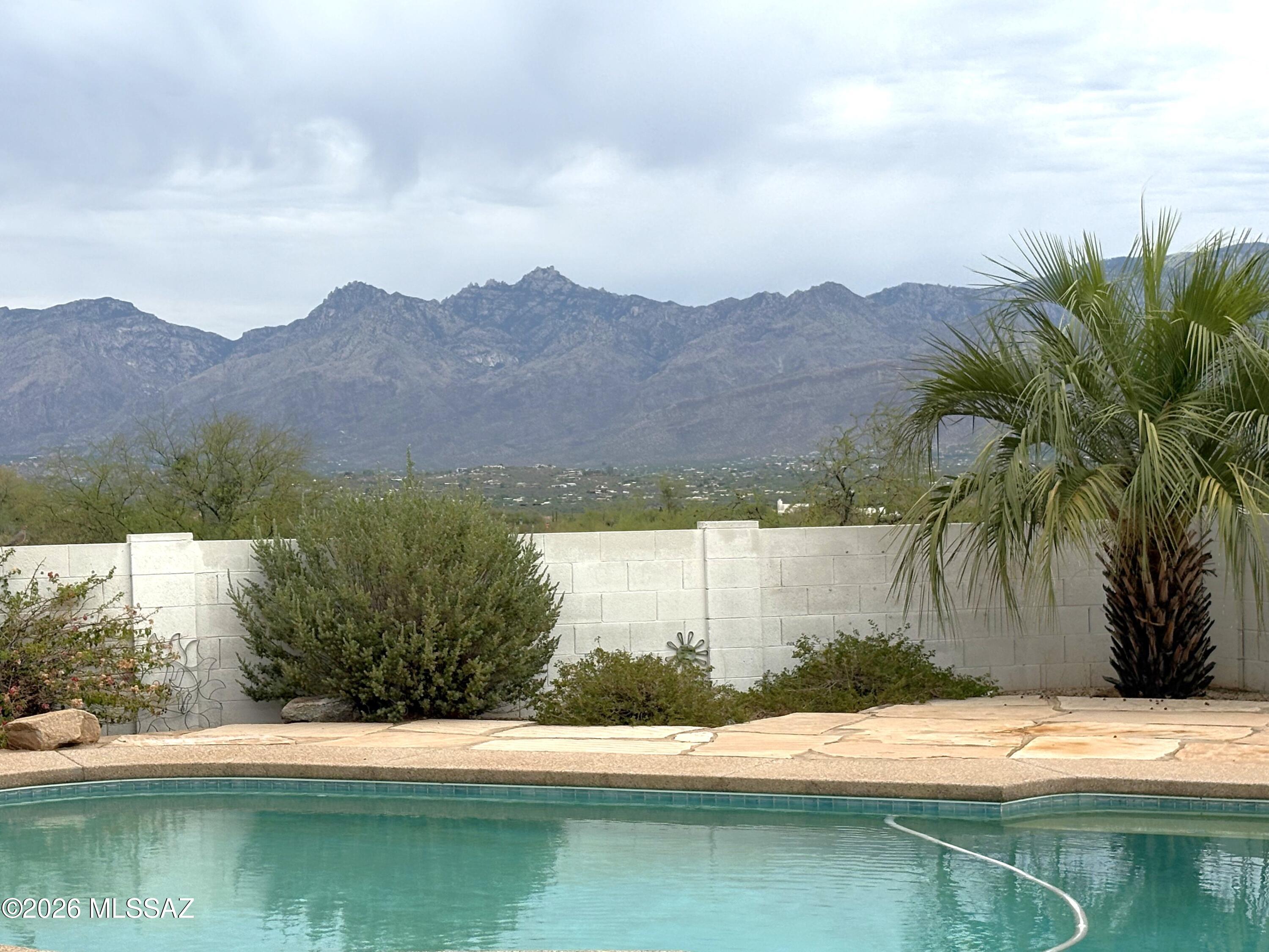 Tucson Living at Its Finest! Nestled on a quiet cul-de-sac in the coveted Tanque Verde School District, this stunning 4-bedroom, 3-bath home offers 2,519 sq ft of thoughtfully designed living space with north-south orientation. Step inside to a bright, open floor plan that flows seamlessly to your private backyard oasis complete with a sparkling pool & breathtaking mountain views. The 3-car garage provides ample space for vehicles, storage, or a workshop. Located in one of Tucson's most desirable eastside neighborhoods, you're minutes from top-rated schools, hiking trails, & the natural beauty the Sonoran Desert is famous for. Whether you're entertaining poolside or watching the amazing Arizona sunsets, this home delivers the ultimate Arizona lifestyle. Welcome to your new home.