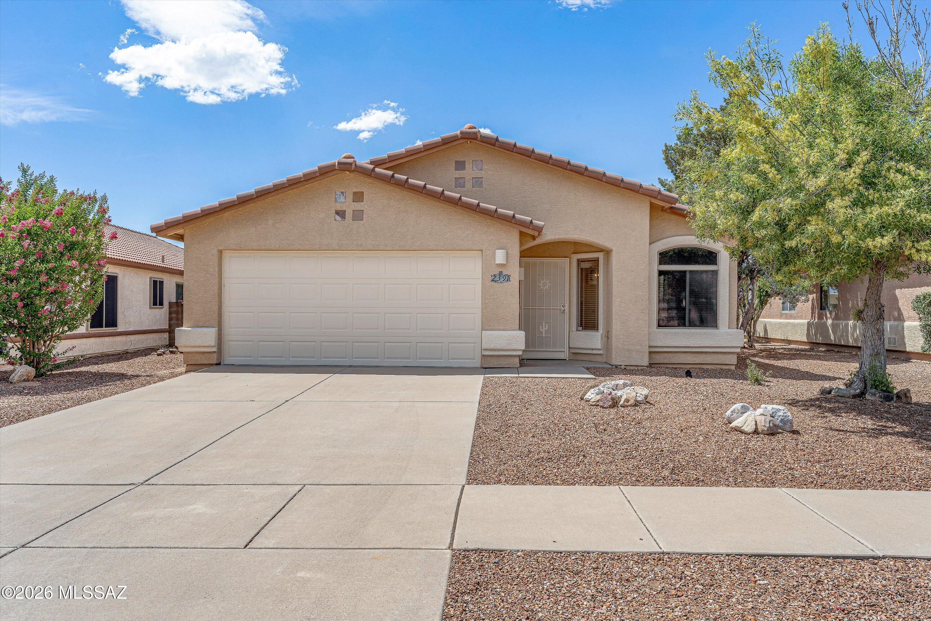 Discover a move-in-ready sanctuary offering the perfect mix of clean contemporary style and unparalleled modern convenience in the heart of Oro Valley. Boasting 1,630 square feet of brilliantly designed, totally renovated living space, this 3BD/2BA single-story residence greets you with a bright open-concept layout and a crisp, welcoming neutral color palette designed for effortless personalization. Featuring all new flooring, cabinetry, countertops, and appliances, this home is sure to impress. At the center of daily life is a beautifully upgraded chef's kitchen. Perfect for preparing casual morning meals or hosting weekend gatherings, it features solid quartz countertops, rich custom cabinetry, a dedicated pantry, and premium stainless-steel appliances. The kitchen integrates seamlessly with a spacious great room, where large windows invite an abundance of the bright Southern Arizona sunshine. The home's smart footprint provides three generous, well-separated bedrooms with plush carpeting and ceiling fans, including a spacious master suite complete with an expansive walk-in closet and a private, adjoining bathroom. Step outside to find a peaceful, fully enclosed backyard oasis. Whether sipping your morning coffee under the shaded covered patio or relaxing with friends during cool desert evenings, this private lot offers a serene setting framed by iconic Southwestern big-sky views. Location is arguably this home's finest feature. Situated in a quiet, established enclave with its own neighborhood play park, you are mere blocks away from premier retail centers, the Oro Valley Marketplace, and everyday essentials. Experience fine dining and shopping, grab local brews at The Hoppy Vine, or catch a weekend show at the Gaslight Music Hall, all just minutes from your front door. For outdoor enthusiasts, the magnificent hiking trails of Catalina State Park are right around the corner, blending unbeatable city amenities with world-class nature.