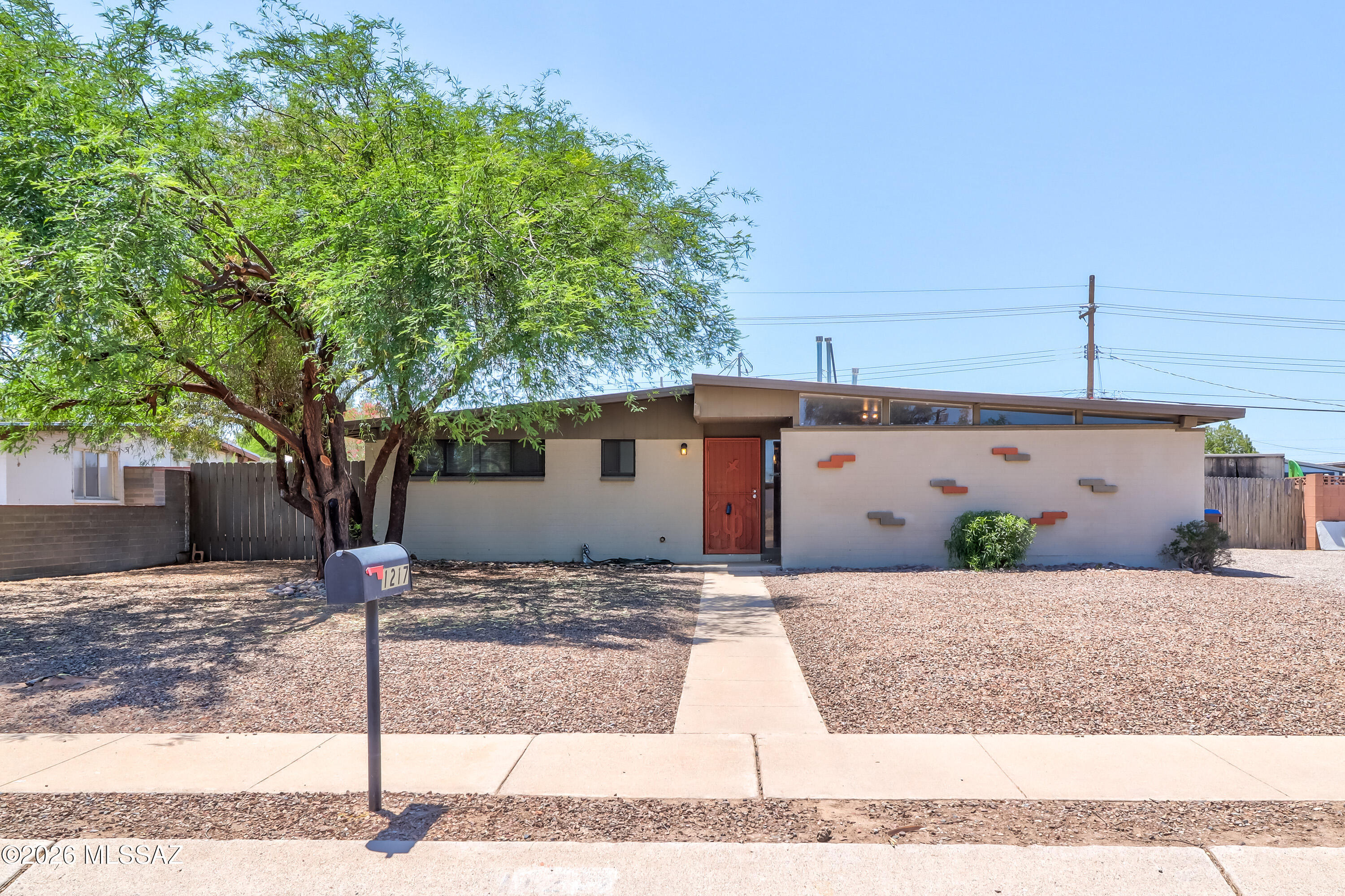 Located in the Northwest area of Tucson, this charming home has 1,426 square feet of living space with 3 beds, 2 baths and a large backyard. When you step inside,  it's a split floorplan with an open concept. The kitchen is spacious, has lots of cabinets for storage, and ample countertop space. The primary bedroom is spacious and has 2 closets. The backyard is easy maintenance that leaves it up to the buyer's imagination to do what you want, has an extra storage room, and large shed. This home is close distant to  schools, grocery shopping, Tucson Mall, bowling, restaurants, and has NO HOA. Plenty of room for RV, boat, or cars. Come see TODAY!