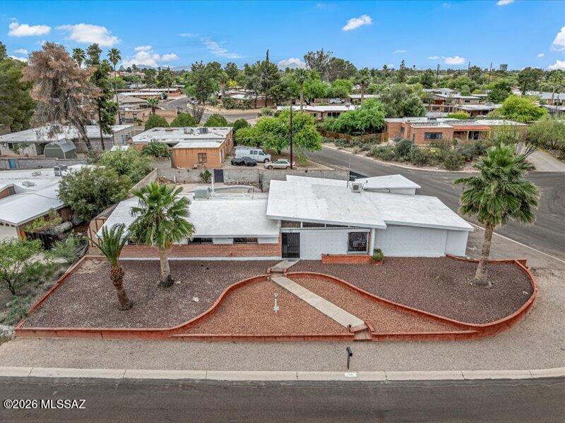 Move-in ready & centrally located in desirable Rose Hill Estates, this charming mid century masonry home sits on a spacious corner lot and offers 4 bed 2 bath with open concept living area. Fresh interior paint enhances the bright functional layout, while the solid construction adds timeless character. Enjoy a large lot with endless potential in an established neighborhood. Pool is non functional and conveys as-is. Rear addition is not permitted & not included in square footage. Buyer to verify square footage, see floor plan.
