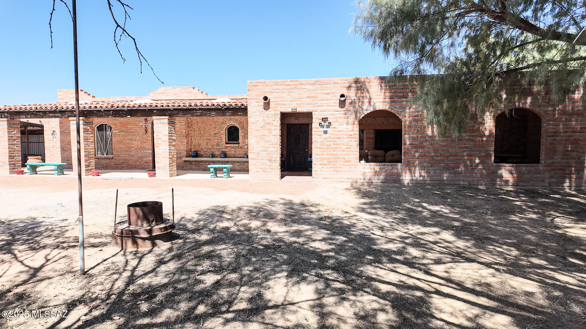 Western Charmer!!! This unique property has 3 houses on 5.56 acres. Fenced & cross fenced with irrigation well & lots of storage. Horse/Livestock property, Multi-generational, Rentals, Air BnBs, The First house is handicap accessible, 2 bedroom-2 bath home (1578 sq. ft.) Second house has 1 bedroom & 2 bath (950 sq. ft.), Third home is nicely updated with granite & Saltillo tile. 1 bedroom & 1 bath (1,100 sq. ft.) Spacious wood shop could be great for your hobby area. Separate small building with bathroom that can be used for office or gym or Air BnB. Homes are on water district plus private irrigation well. Drip system installed for trees & plants. The entire 5.56 acres are fenced and cross fenced. Perfect for horses or livestock.
