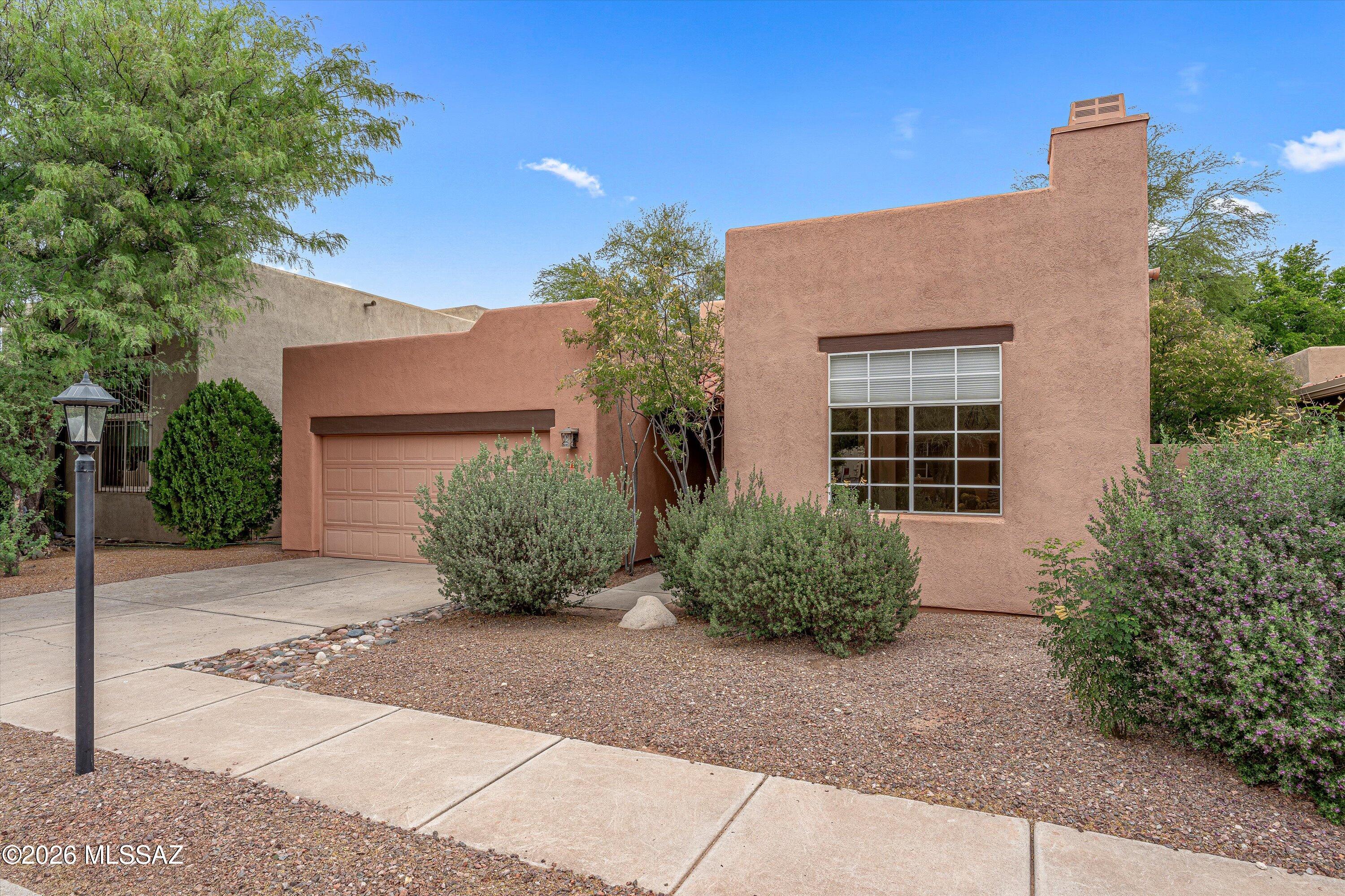 Don't miss this fantastic opportunity to own this 3 bedroom, 2 bath home in the heart of central Tucson.  Perfectly situated within walking distance to the Tucson Racquet Club and The Loop. Just minutes from the University of Arizona and the vibrant Campbell Corridor, you'll love the easy access to top restaurants, shopping, and everyday conveniences.  Inside, the home feels bright and airy with high ceilings and abundant natural light. Bamboo flooring adds warmth to the living spaces, while classic Saltillo tile in the kitchen and bathrooms bring character and Southwestern charm. A screened-in patio offers the perfect spot to relax or entertain year-round. HVAC new in 2023.