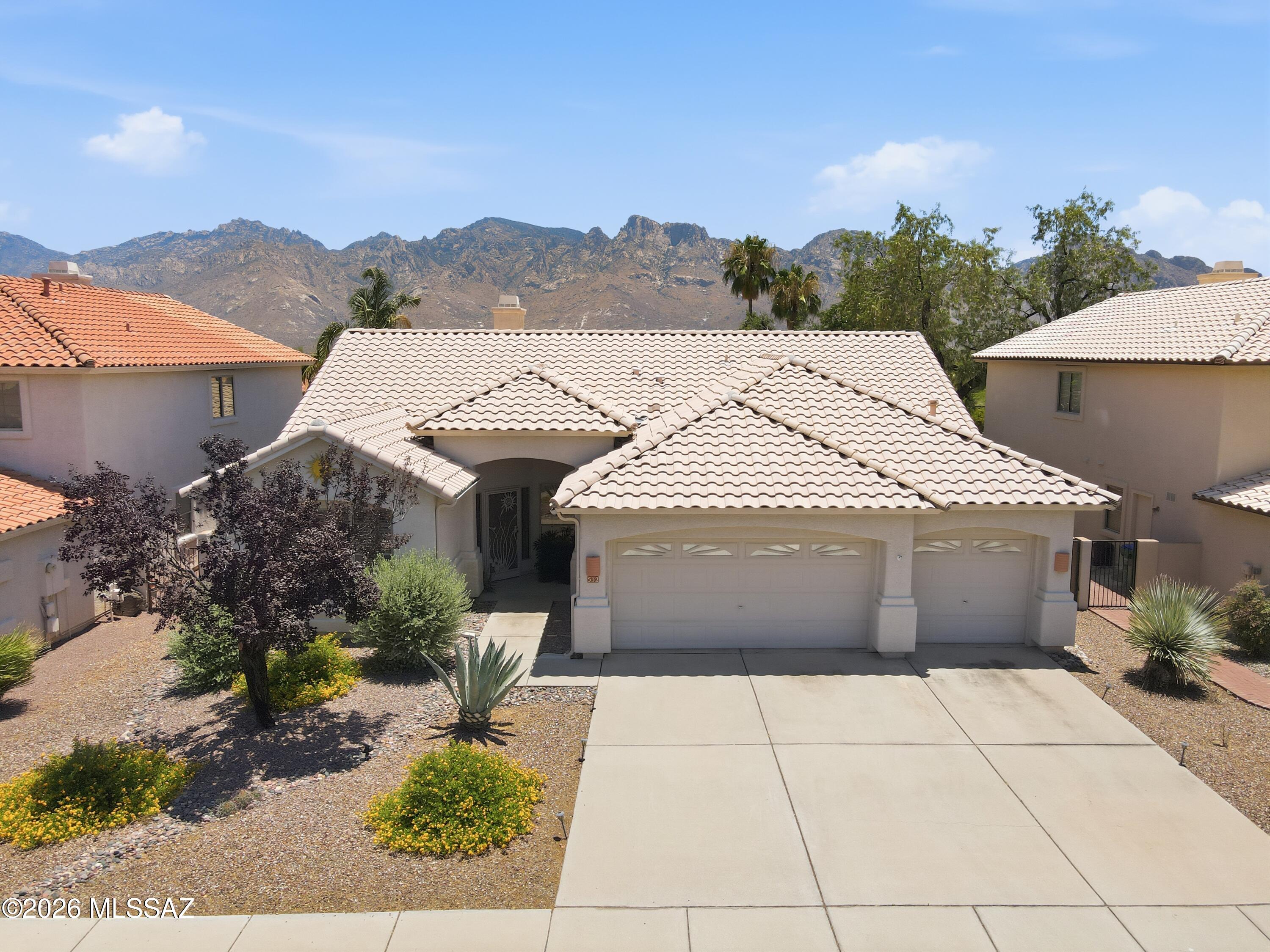 Nestled in the highly desirable Rancho Vistoso community of Oro Valley, this beautifully maintained 4-bedroom, 2-bath residence offers the perfect blend of comfort, style, and Arizona outdoor living. With 2,137 square feet of thoughtfully designed living space, the home features an open and inviting floor plan filled with natural light and ideal for both everyday living and entertaining.

The spacious kitchen is equipped with granite countertops, stainless steel appliances, a gas range, abundant cabinetry, and ample prep space, making it a welcoming hub for gathering with family and friends. The open-concept design flows seamlessly into the dining and living areas, creating an ideal setting for hosting guests or enjoying quiet evenings at home. The split-bedroom floor plan provides privacy for the primary suite while offering flexibility for guests, a home office, or additional living needs. Large windows throughout the home showcase views of the lush backyard and bring the beauty of the outdoors inside.

Step outside to your own private desert oasis. The resort-style backyard is designed for year-round enjoyment, featuring a sparkling pool and spa, mature shade trees, and producing citrus trees that enhance both the beauty and functionality of the outdoor space. Multiple entertaining areas provide the perfect setting for barbecues, gatherings, or simply relaxing while enjoying Oro Valley's renowned sunsets and mountain views.

Located within the sought-after Rancho Vistoso master-planned community, residents enjoy miles of walking and biking paths, neighborhood parks, golf courses, and easy access to some of Southern Arizona's best hiking and outdoor recreation. Conveniently situated near Oro Valley Marketplace, shopping, dining, medical facilities, and top-rated schools, this home offers an exceptional lifestyle in one of the region's most desirable communities.

Combining a spacious floor plan, updated finishes, a pool and spa, and a beautifully landscaped backyard retreat, this Rancho Vistoso home presents a wonderful opportunity to experience the best of Oro Valley living.