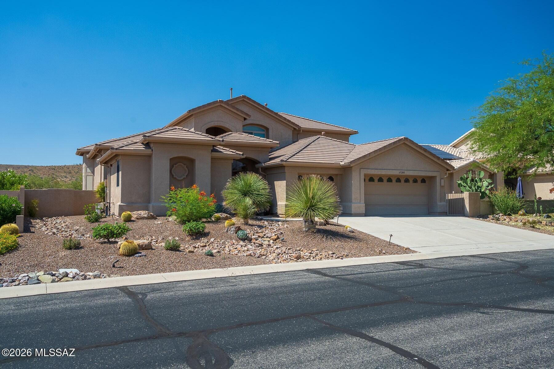 Welcome to this highly sought-after Sundance model with private casita, located in the desirable SaddleBrooke 55+ community. This exceptional home offers 4 BD/3.5BA, plus den, with 3,276 sq. ft. in the main residence and an additional 300 sq. ft. casita, perfect for guests seeking privacy and comfort. Upon entry, you are greeted by formal living and dining spaces that flow seamlessly into an inviting open-concept family room. The chef's kitchen features granite countertops, stainless steel appliances, beverage fridge, breakfast bar, and a sunny breakfast nook, ideal for entertaining or everyday living. The spacious owner's suite is conveniently located on the main level and showcases a spa-like bath with dual vanities, a soaking tub, walk-in shower, and generous walk-in closet. Upstairs, two oversized guest bedrooms share a Jack-and-Jill bathroom, offering comfort and convenience for visitors. Step outside to enjoy the expansive Arizona room with hot tub, perfect for year-round relaxation. The resort-style backyard features a solar-heated pool and backs to private open space, creating a serene desert retreat. Residents of SaddleBrooke enjoy world-class amenities including golf, tennis, pickleball, dining, and an active social calendar. This home truly offers the best of luxury, comfort, and lifestyle living.