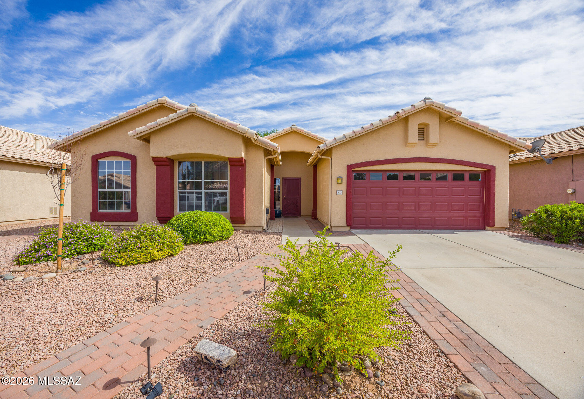 Welcome home to this beautifully maintained 3-bedroom, 2-bath residence featuring quality upgrades and an ideal location. The inviting interior showcases elegant travertine tile flooring, granite countertops, a gas range, ceiling fans and upgraded window coverings throughout. The spacious primary suite offers a relaxing retreat with a luxurious soaking tub. Enjoy peace of mind with a brand-new AC system installed in May 2026, complete with a 10-year parts warranty and 5-year labor warranty. Community amenities include two pool areas--one with a splash pad and another with a kiddie pool--plus a spa/hot tub and a community center with kitchen facilities. Conveniently located near Cortaro and I-10 shopping, dining, and Tucson's popular walking and biking loop.