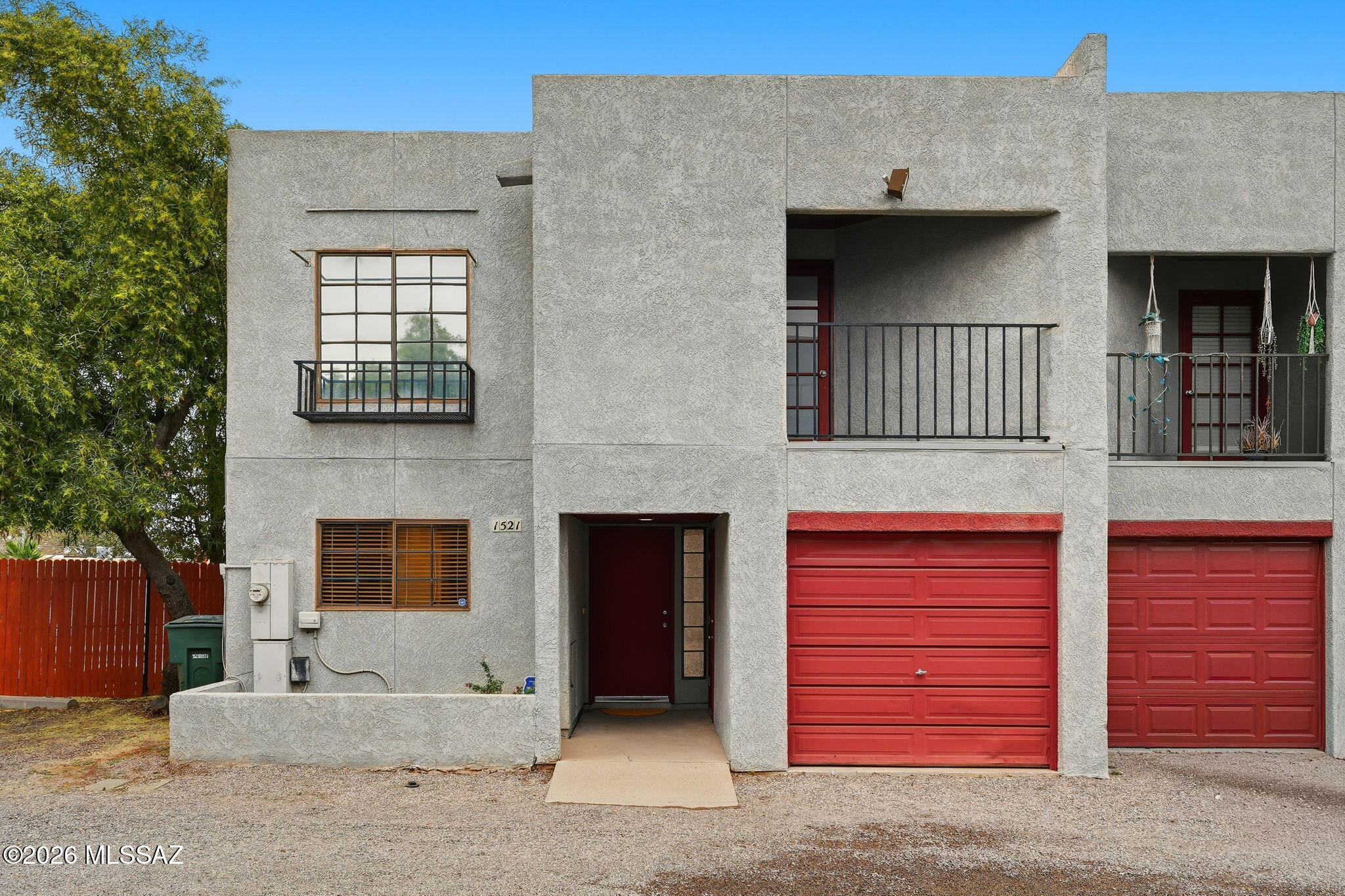 Fantastic opportunity for both homeowners and investors. Minutes from University of Arizona, dining, shopping and hospitals. Step inside this charming townhome, you'll find a bright, open floor plan filled with natural light and soaring ceilings. The main floor features a seamless flow between the kitchen, dining and living areas. Powder room downstairs. Upstairs, enjoy the private balcony off the primary bedroom and additional 2 bedrooms. Step outside to covered back patio and take in Catalina Mountain views. Offering both a single-car garage and an additional dedicated parking space. Filter under kitchen sink is water filter not softner. Great investment opportunity - no restrictions on rentals.