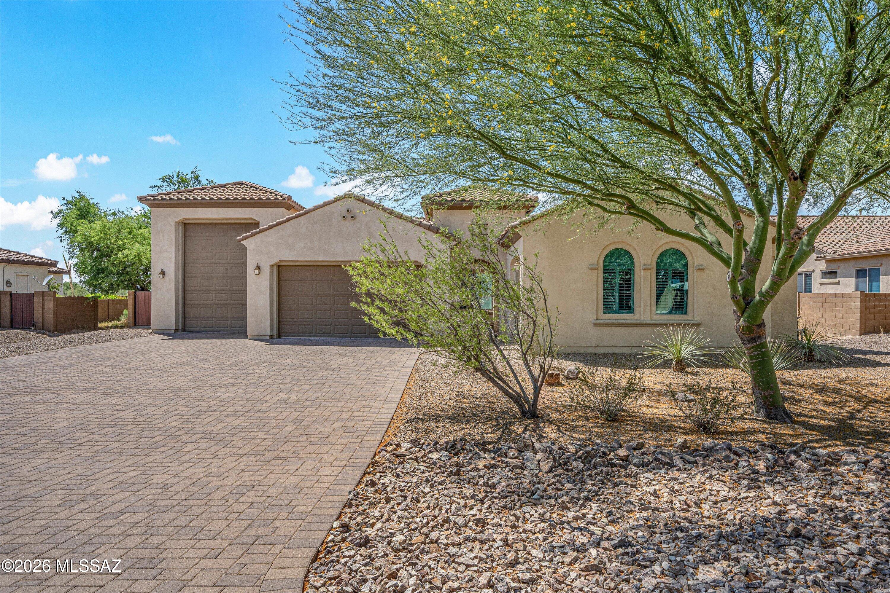 Fabulous Pulte home built in 2018 in gated  Desert Willow Ranch, 3,148 sq ft home w/ a beautiful driveway of pavers leading to a total of 3 garages one being an RV garage. Enjoy a designer kitchen w/all the extras, stainless steel appliances, lg walk in pantry, tons of shelving, split floor plan, 3 Br with 3 in-suite baths , 1/2 bath, office/den. Backyard boasts a sparkling private pool w/gazebo & built-in BBQ, artificial turf, pavers and backed up to open desert for privacy, mtn & sunset views. Owner pays for landscaping & pool service & HOA dues. Life at its best!  You have to see this one!