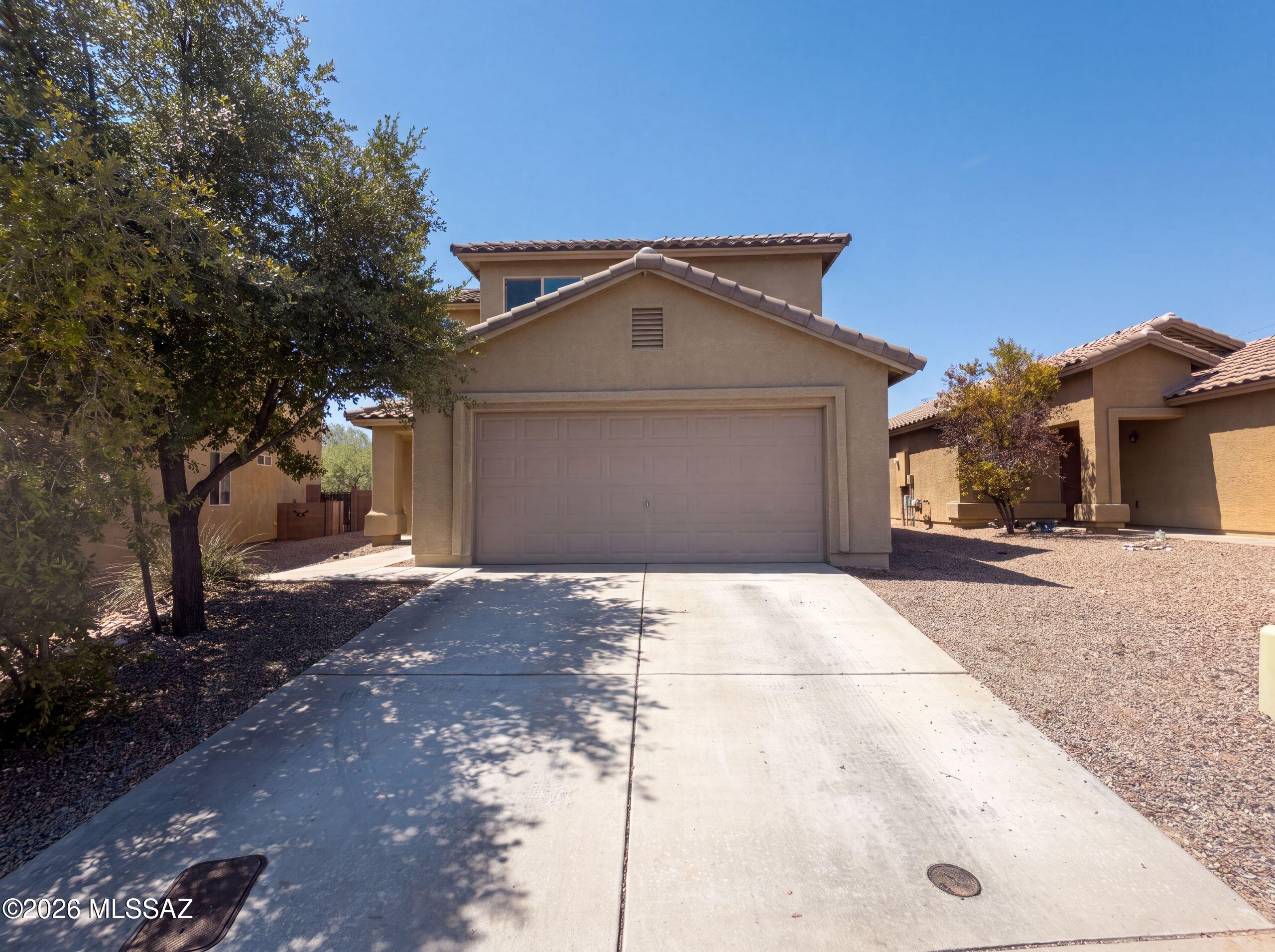 Don't miss 935 W Placita Canalito, a residence that has received a recent partial flooring replacement, contributing to an enhanced functional foundation throughout its main areas, alongside fresh interior paint which brightens and modernizes the entire living environment for immediate occupancy. Enjoy the new feel and move-in readiness of this updated home.. Included 100-Day Home Warranty with buyer activation
