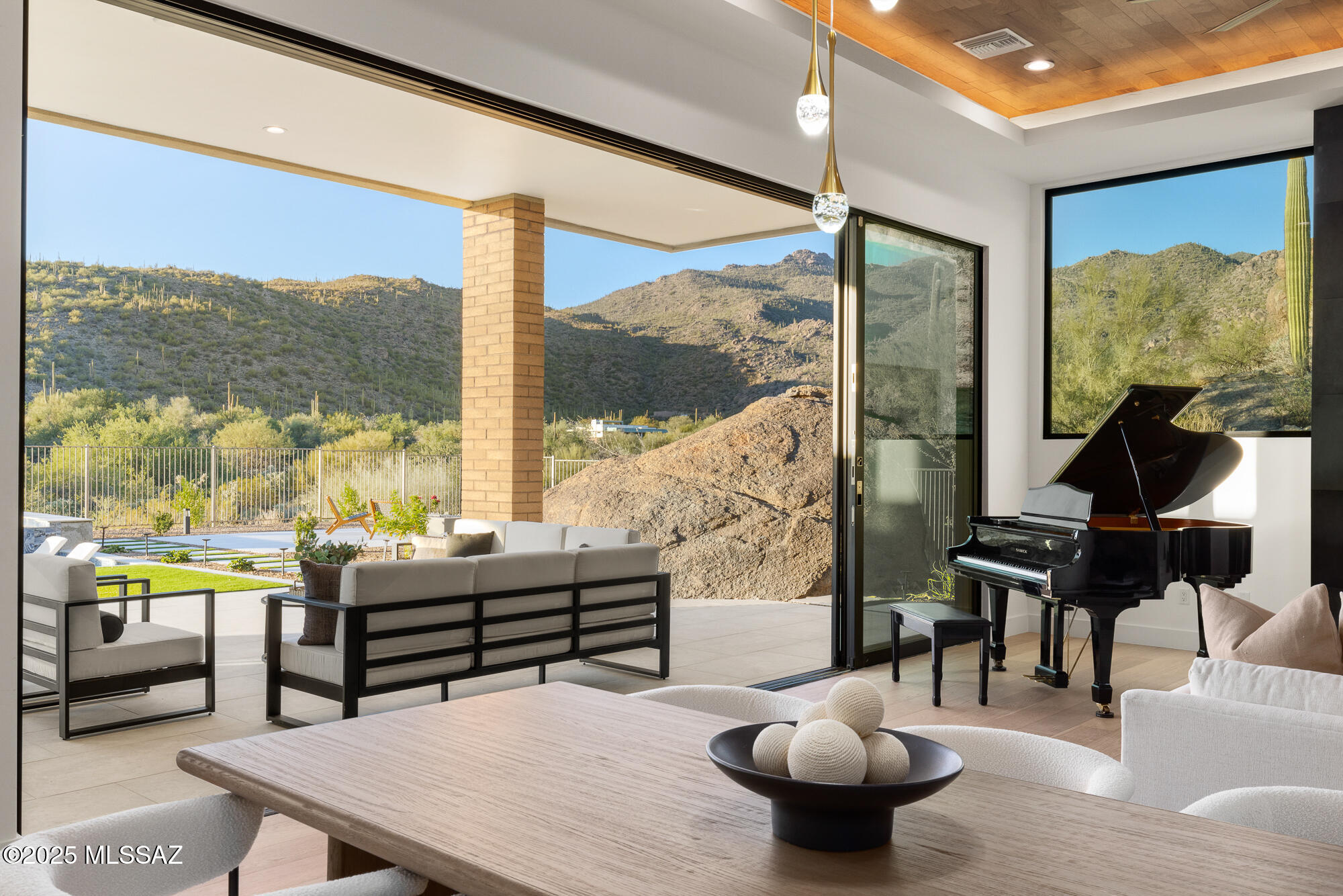 JUST COMPLETED! New within the exclusive gated community of ''The  Overlook'' at the Gallery in Dove Mountain, built directly against a stunning natural rock formation, offering an unmatched setting with views of the mountains and golf course. Designed for seamless indoor and outdoor living, the open-concept great room flows to a deep covered patio, resort-style pool & spa, outdoor kitchen, and fire pit lounge area. The Chef's kitchen includes top of the line appliances and a waterfall edge quartz island. A separate guest casita provides flexible living for visitors, an office, or a gym. Easy living & no interior steps.  Just minutes from the Ritz-Carlton, Gallery Golf Club w/Sports & Fitness Center.
