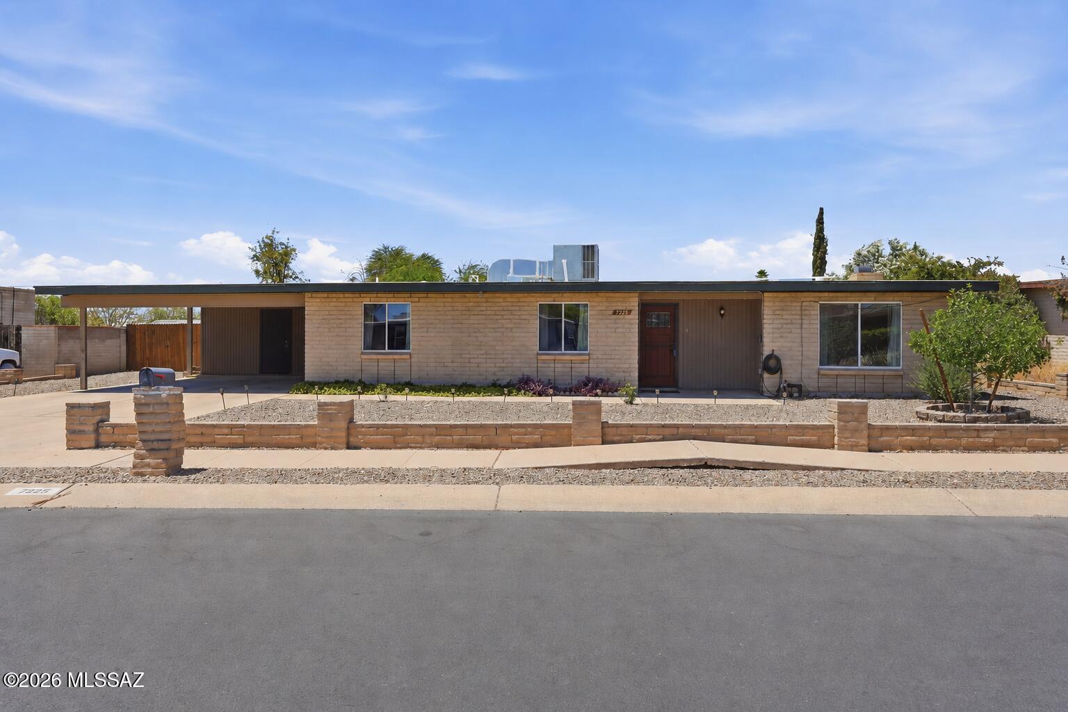 Welcome home to this updated 3-bedroom, 2-bath residence located in a well-established Eastside neighborhood. The seller has tastefully remodeled the kitchen and bathrooms, creating a fresh, modern feel throughout. The open-concept floor plan seamlessly connects the kitchen and dining area, making it ideal for both everyday living and entertaining. The inviting living room features a rustic fireplace, adding warmth and character to the heart of the home. Step outside to an oversized backyard with a covered patio to enjoy stunning mountain views with plenty of room for recreation, gardening, or future expansion. RV gates provide convenient access and storage, while a storage shed offers additional space for tools and equipment. Close to shopping, DMAF Base, w/easy access to I-10 & downtown