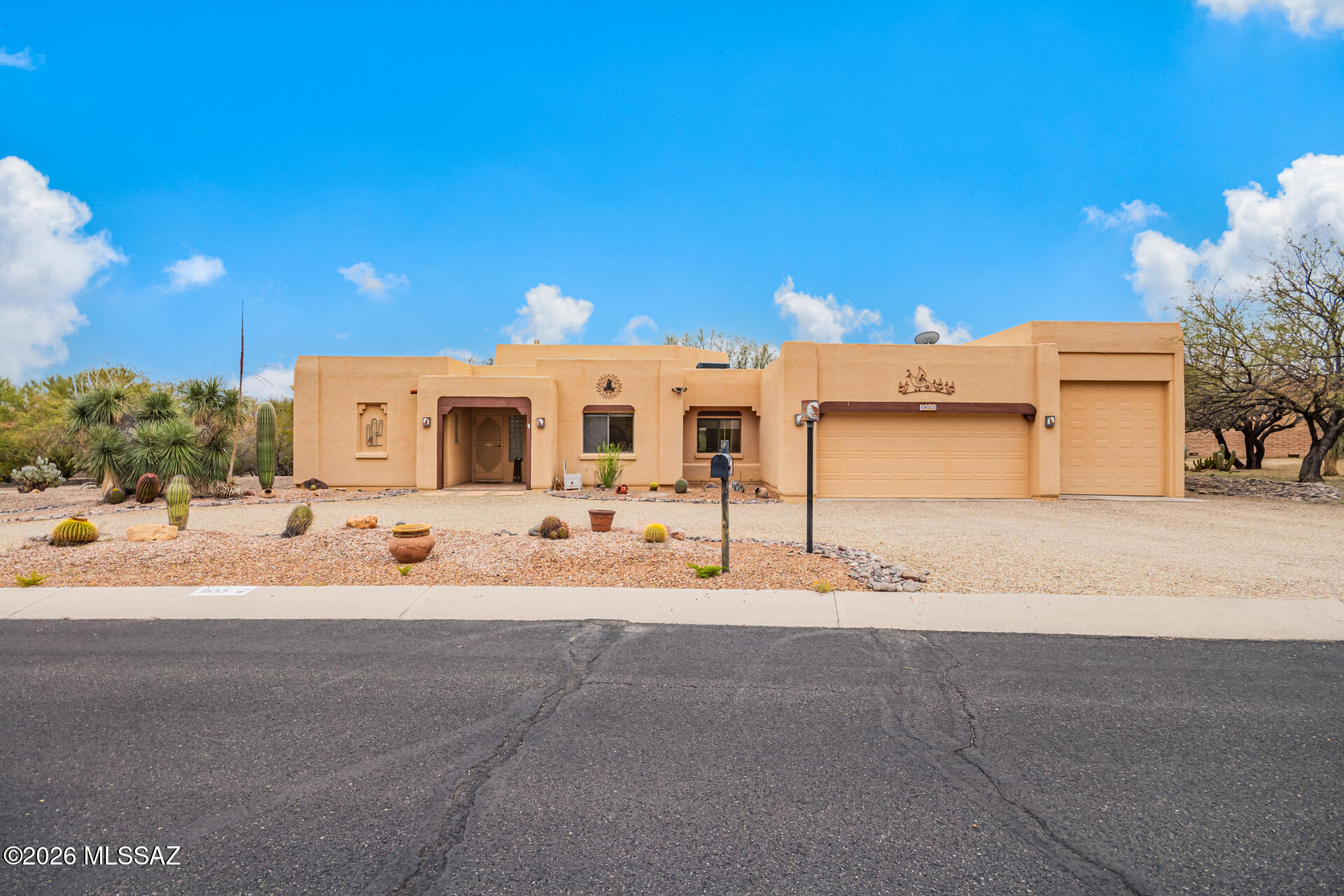Rare opportunity on nearly half an acre in Sahuarita! This 1,935 sq ft Southwestern home features 2 bedrooms, 2 baths, plus a versatile den perfect for a home office, hobby room, or guest space. Exposed wood beams, soaring ceilings, and a cozy fireplace create warmth and character. The oversized garage plus attached RV garage provide exceptional storage for vehicles, toys, and hobbies. An additional heated and cooled office/storage room off the garage offers even more flexibility. Enjoy mountain views, a circular driveway, and the privacy of a spacious .40-acre lot. Short sale approval required. Property is being sold AS-IS