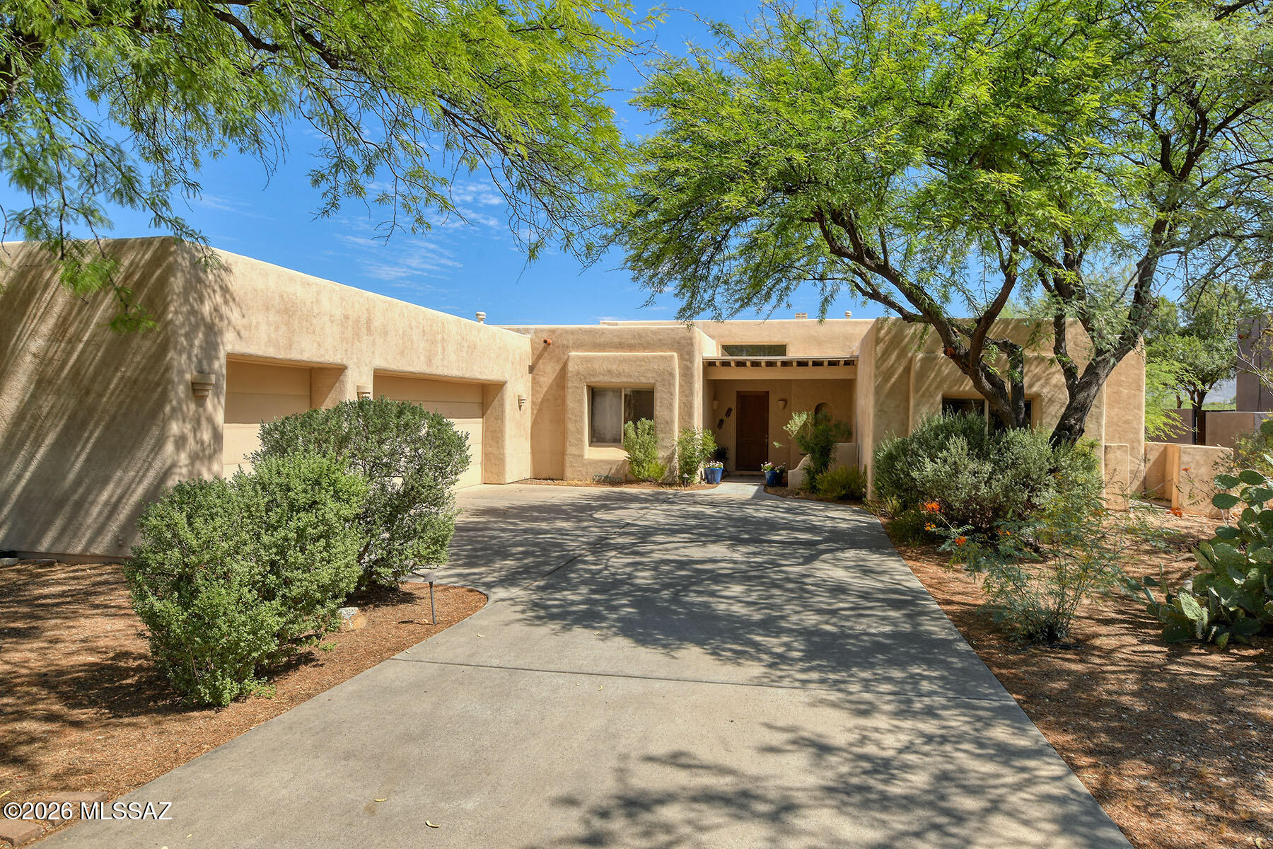 I have to mention that this is a beautiful find in a treasured gated community of 23 homes.  I also need to mention it is a great value and homes rarely come up in here for 2 simple reasons.. perfect location (feels far away but so close to everything.  Most 10 min from almost all) and with a bit of updating....a strong investment find. In 30 years I have seen alot of floorplans and this one lives so well.  Basically split main suite, 2 bedrooms and a bath tucked away, and lastly a completely separate guest bedroom and bath.  All light an airy , high ceilings, and a sense of indoor outdoor living.  True Tucson Lifestyle