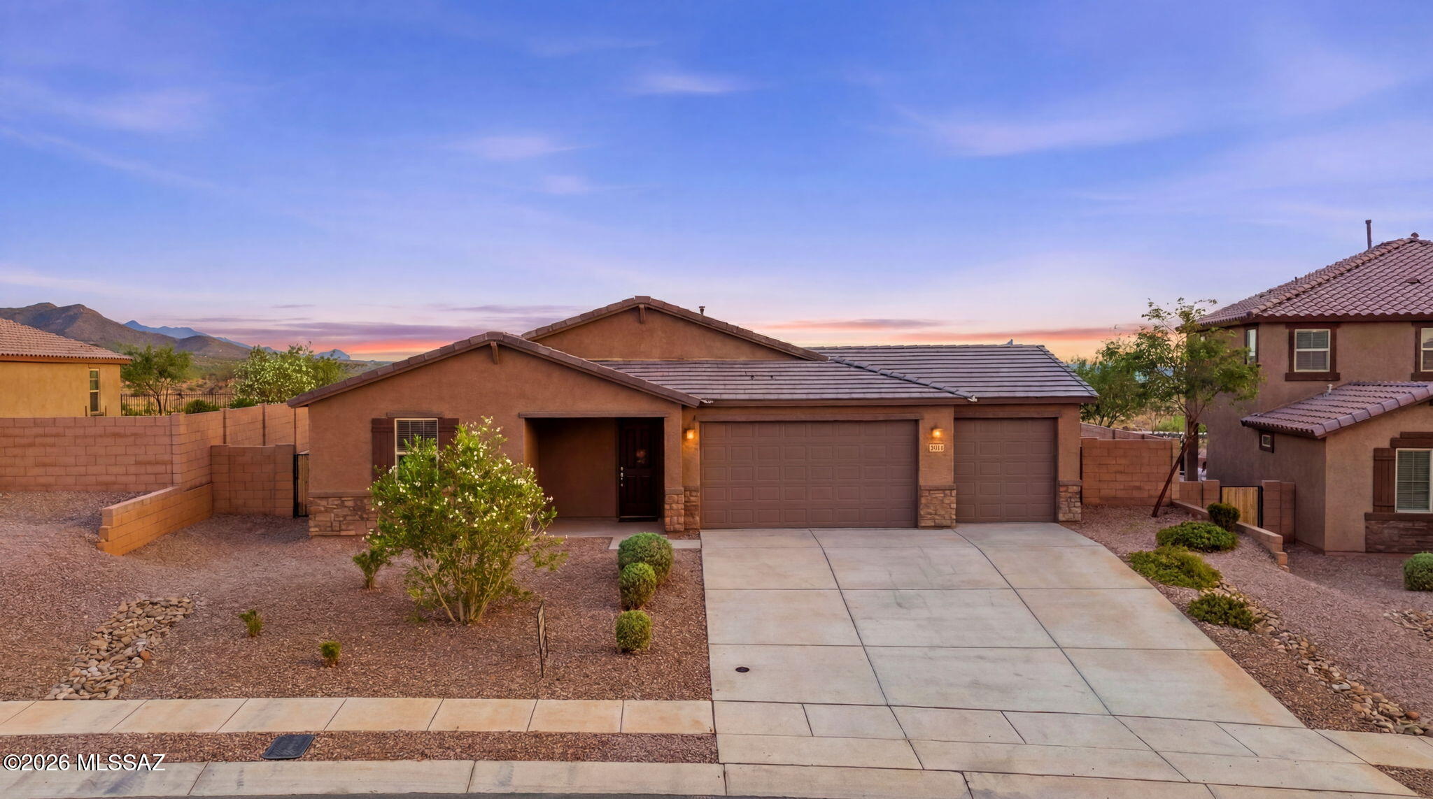 HONEY STOP THE CAR! LET'S BUY THE MODEL HOME WITH A 4 CAR GARAGE! Experience modern Southwestern living in this stunning 2023-built former model home, perfectly situated to capture breathtaking Arizona sunsets. Backing up to open space with no rear neighbors, this 1,852-square-foot residence offers the ultimate blend of privacy and contemporary comfort in the highly sought-after Vail School District. Step inside a light, bright, and airy open floor plan featuring modern recessed lighting and a sophisticated neutral color scheme. The heart of the home is a chef-inspired kitchen boasting expansive granite countertops, a large central island, premium stainless steel appliances, and a crisp, pleasant aesthetic perfect for entertaining. Elegant wood-look ceramic tile flows seamlessly through the high-traffic living spaces, while plush carpet adds warmth and comfort to all four spacious bedrooms. The rare, expansive 4-car garage provides abundant space for vehicles, desert toys, or a dedicated workshop. Combining a nearly new build quality with an unbeatable location, this turnkey gem is the perfect place to watch the desert skies turn pink and gold every evening. 
Staged items in home will be removed and do not convey at COE.