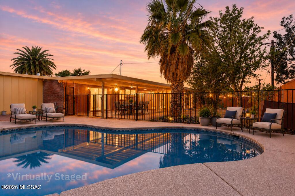 Brand new roof and a pool?! Yes! This is the one you've been waiting for! This east side beauty is fully move-in ready, has 3 beds, 2 baths with a brand new roof installed  (with roof warranty) April of 2026 and 1.5 year old HVAC. The major upgrades are already DONE! Not to mention that the home has been meticulously cared for! The bright, open layout flows into a large Arizona room perfect for relaxing, working, or entertaining! Step outside to your own private backyard oasis with a sparkling pool, lush space, extended covered patio and room to host unforgettable nights! Clean, upgraded, and dialed-in, this one checks every box! Homes like this do NOT last! Come see it before it's gone!