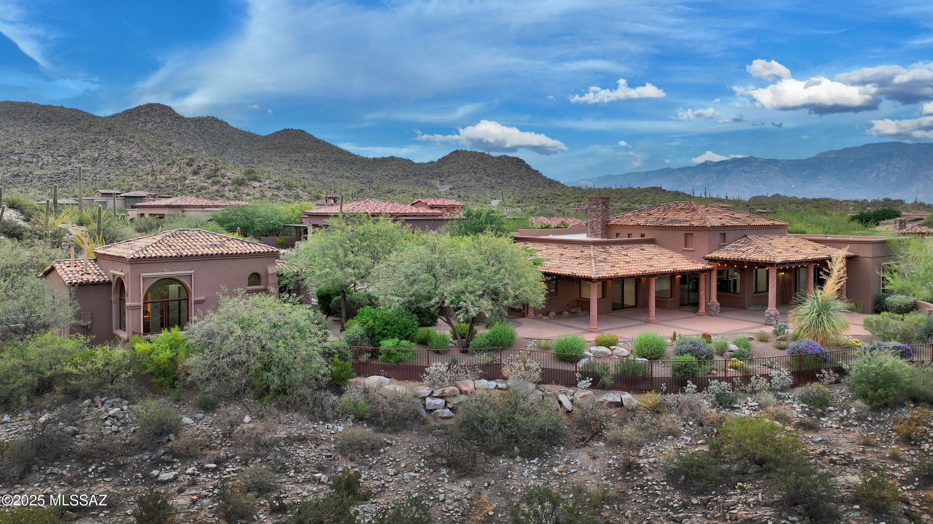 Amazing privacy and tranquility at the base of the Tortolita Mountains bordering over 1000 acres of saguaro studded conservation areas. Fabulous Tuscan style masonry-built home with resort-like one acre lot and serene desert, sunset, and completely unobstructed mountain views within the prestigious guard-gated Stone Canyon development! Perfect 3,100 SF split layout with double master, den/office, and 715 SF detached casita. The deep covered expansive rear patio, the front courtyard, and kitchen patio are distinguishing exterior features allowing for a variety of outdoor settings. Agent is available for tour of home and all amenities offered in Stone Canyon.