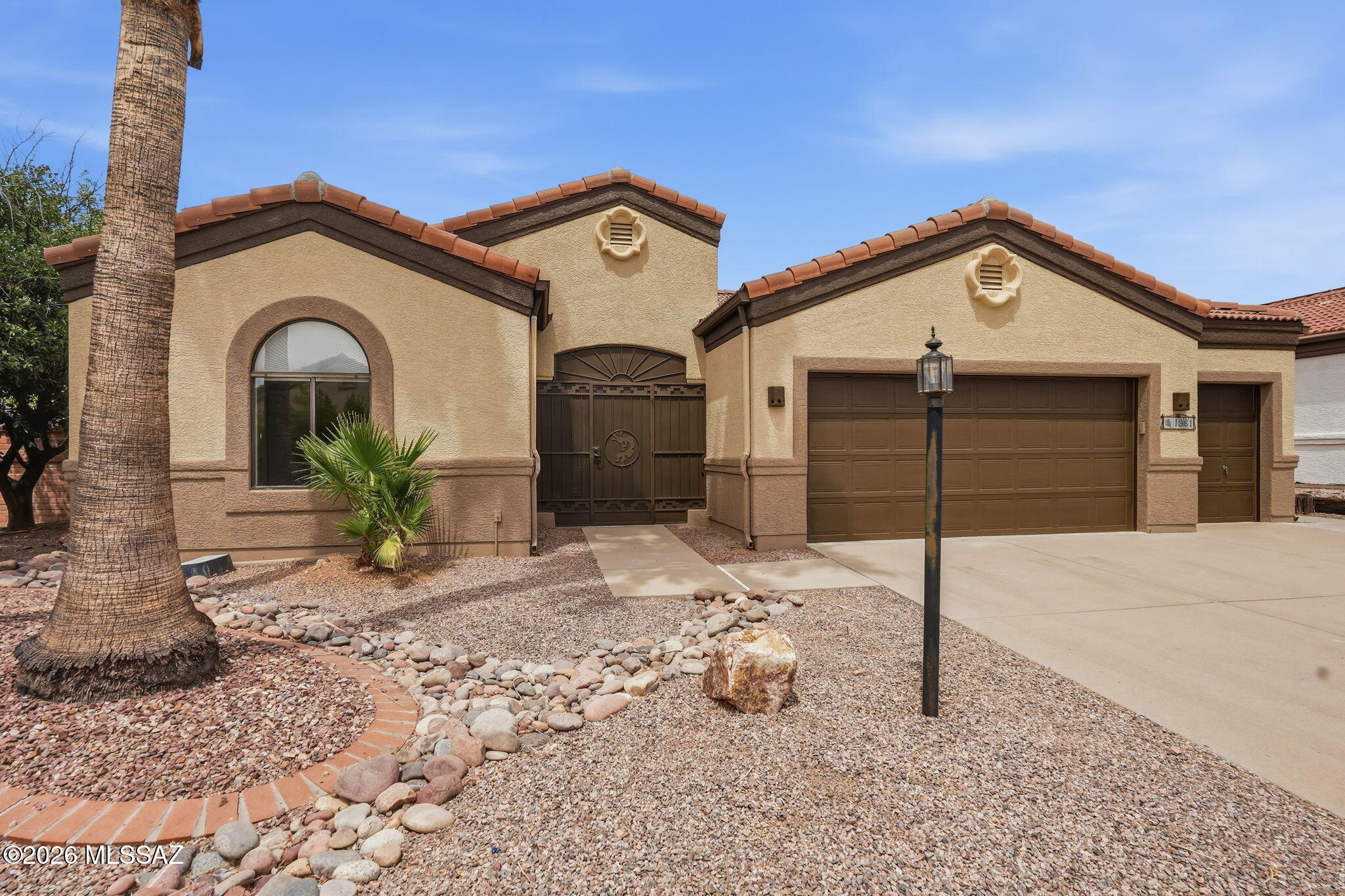 Nestled within the premier Quail Creek community, this beautifully updated residence lets you spend less time on maintenance & more time enjoying the Arizona lifestyle. This delightful refreshed home offers exceptional value with brand-new luxury plank vinyl flooring throughout, fresh interior and exterior paint, a brand-new HVAC system, and a brand-new roof backed by a warranty--giving you peace of mind for years to come. Designed for both comfort and entertaining, the home features inviting living spaces anchored by a cozy gas fireplace with built-in seating and custom cushions. The adjoining family room offers flexible space for relaxing, hobbies, or gathering with friends. The kitchen is bright and welcoming with a cheerful breakfast nook, gas cooktop, pantry cabinet, and plenty of workspace for everyday living. Wake each morning to tranquil golf course views from the spacious primary suite, complete with private access to the screened patio, dual vanities, a walk-in shower, and a generous walk-in closet. Step outside to your own backyard retreat where a sparkling private pool and fully screened patio create the perfect setting to enjoy Arizona's beautiful weather without the nuisance of insects. Car enthusiasts, hobbyists, and golf lovers will appreciate the oversized 2.5-car golf cart garage, thoughtfully equipped with tile flooring, a mini-split heating and cooling system, utility sink, workshop area, built-in cabinetry, overhead storage, central vacuum system, water softener, newer water heater, and convenient laundry area with washer and dryer. Surrounded by mature landscaping and located in the highly sought-after active adult resort community of Quail Creek, you'll enjoy world-class amenities including championship golf, pickleball, tennis, fitness centers, resort-style pools, creative arts, restaurants, and an endless calendar of social activities. This is more than a home--it's the carefree Arizona lifestyle you've been waiting for.