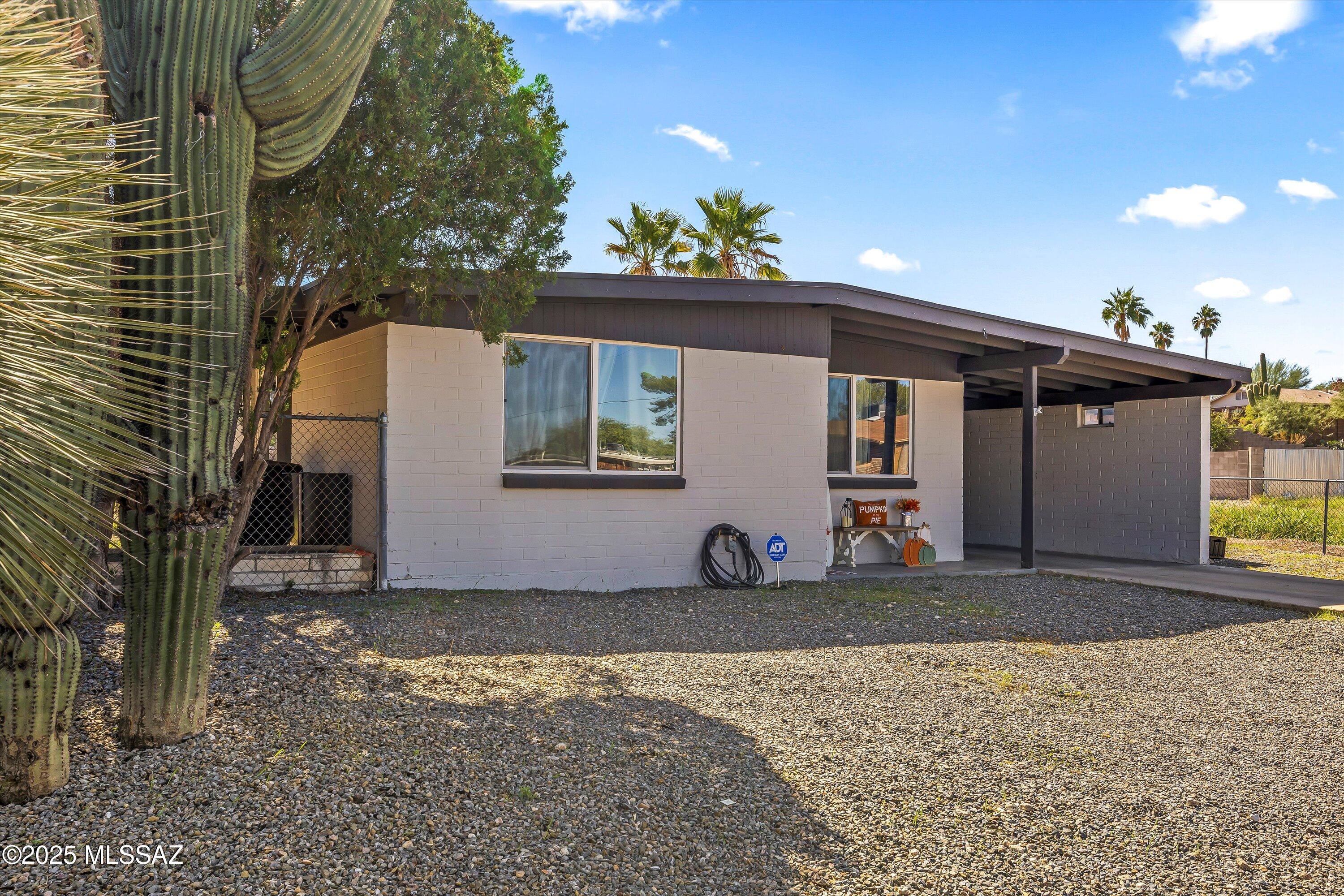 Seller will accept or counter offers between $299,000 and $315,000.

Welcome home to this charming ranch-style residence nestled in Tucson's desirable Eastside! Offering 1,269 square feet of thoughtfully designed single-level living, this inviting home features 3 spacious bedrooms and 2 full bathrooms, making it an ideal fit for first-time buyers, growing families, or anyone looking to enjoy comfortable, low-maintenance living.

Built with durable block construction, this home combines timeless character with everyday functionality. Step inside to discover a bright and welcoming living room filled with natural light, a dedicated dining area perfect for family meals or entertaining guests, and a well-appointed kitchen featuring abundant cabinet storage, generous counter space, and sleek stainless steel appliances.

Outside, the easy-care desert landscaping showcases mature saguaros, decorative gravel, and plenty of curb appeal, allowing you to spend less time on yard work and more time enjoying your home. The backyard offers endless possibilities to create your own outdoor retreat for relaxing, gardening, or hosting weekend barbecues.

Situated in a quiet, established neighborhood, you'll appreciate being just minutes from shopping, restaurants, parks, schools, and everyday conveniences, with easy access to major roadways for commuting around Tucson. This move-in-ready home offers the perfect blend of comfort, convenience, and Southwest charm--don't miss your opportunity to make it yours!