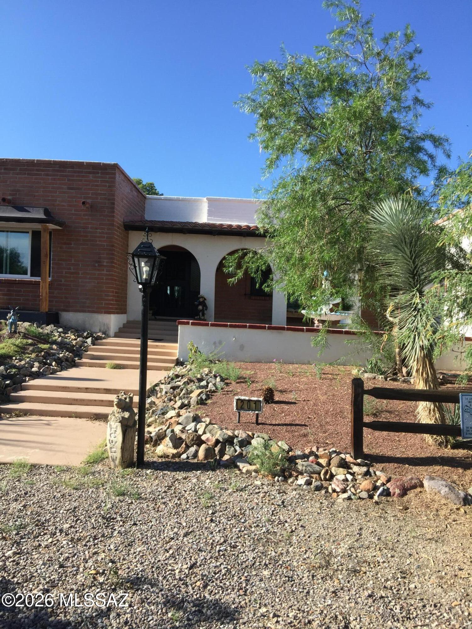 Enjoy Arizona living in this spacious 3-bedroom, 3-bath home on a 1.24-acre corner lot with stunning mountain views. The updated kitchen features granite countertops, abundant cabinetry, and plenty of storage. A bright Arizona room off the kitchen and living room offers additional living space, while two bedrooms each have their own private Arizona room--perfect for a sitting area, office, or hobby room. Relax on the back patio and take in the breathtaking mountain scenery. This home offers comfort, space, and beautiful desert surroundings.