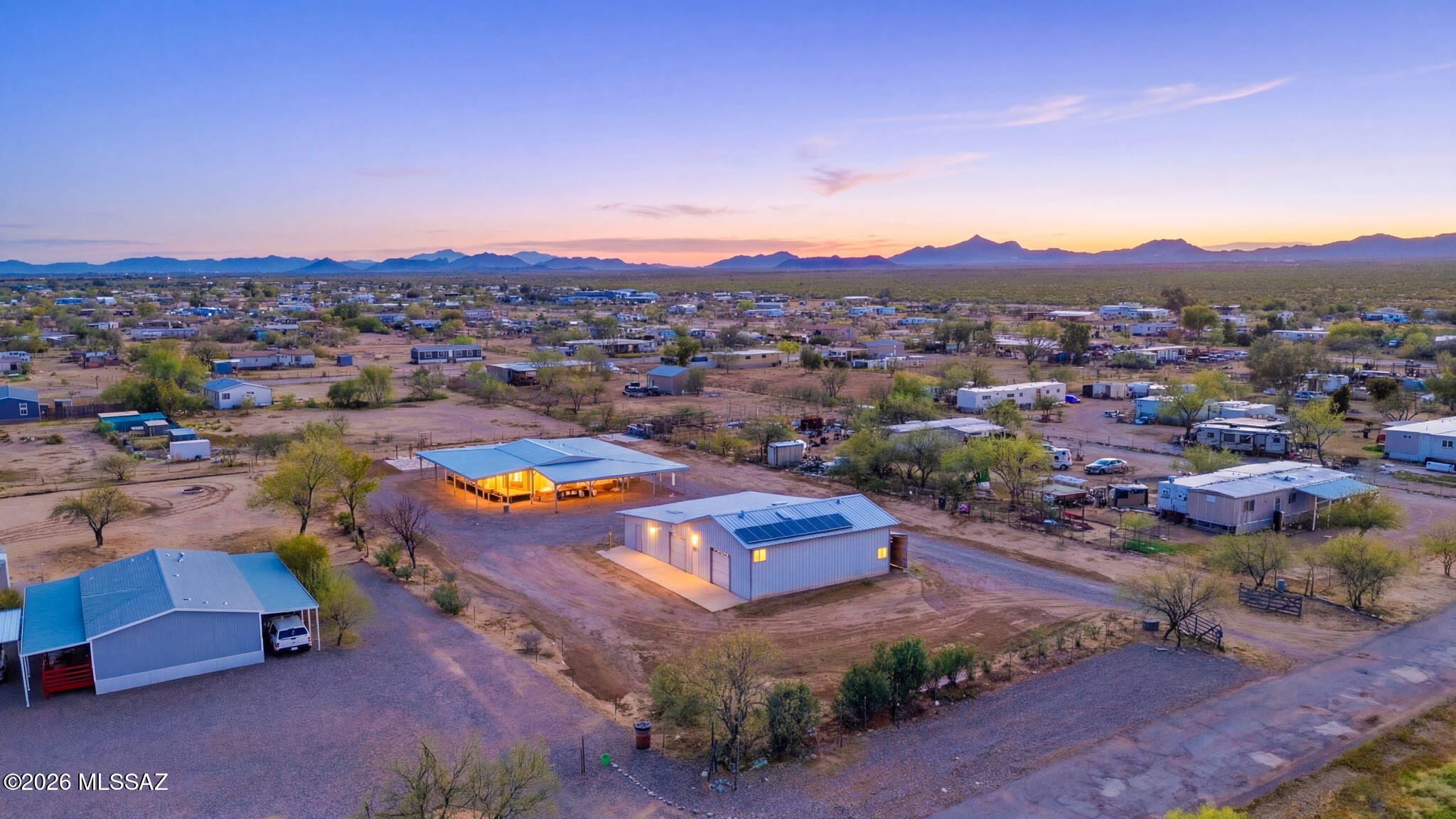 Range priced $299,999 to $325,000. Depending on acceptable terms. Who wants to buy a shop with a house included? If your passion requires power, space, and a place to recharge, this is the ''Unicorn'' property you've been searching for. At the heart of this estate is a professional-grade shop designed for the serious craftsman. Forget extension cords and power constraints; this shop is a powerhouse, featuring 240-volt single-phase power seamlessly integrated into the walls, ceiling, and even the floors. Stay productive year-round with dual MasterCool evaporative coolers and an on-site bathroom that keeps the ''shop life'' separate from the home. Best of all? A massive 27-panel solar array keeps your overhead low while your output stays high. When the tools are down, retreat to a home designed for decompression. Cradled by a majestic wrap-around covered porch, the residence offers the perfect vantage point for sunrise coffees or sunset spirits. Inside, you'll find three comfortable bedrooms with the convenience of a split bedroom layout. Zoning code allows for up to two dwellings. Top it all off with a soak in the private, enclosed spa room. If you're looking for a property that works as hard as you do, you've just found it.