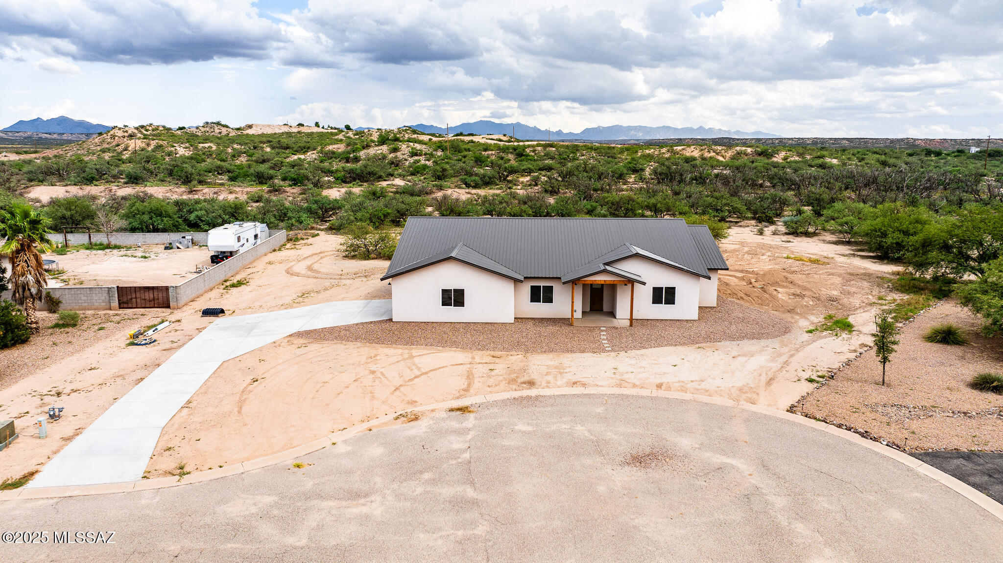MOTIVATED SELLER! BRING ALL OFFERS! Welcome to this stunning new construction home, offering 2470sqft of thoughtfully designed living space on a spacious 1ac lot with paved road access. This 4 bedroom, 2.5 bathroom residence features modern elegance with polished concrete floors, granite countertops, and an open-concept layout perfect for comfortable living and entertaining. The kitchen boasts sleek granite surfaces, ample cabinetry and a functional flow into the dining and living areas. The primary suite is a luxurious retreat with a walk-in shower, soaking tub and generous closet. Additional bedrooms provide ample space, while a versatile den can be used as a home office or bonus room.This home is a rare opportunity to own a brand-new, move in ready property!