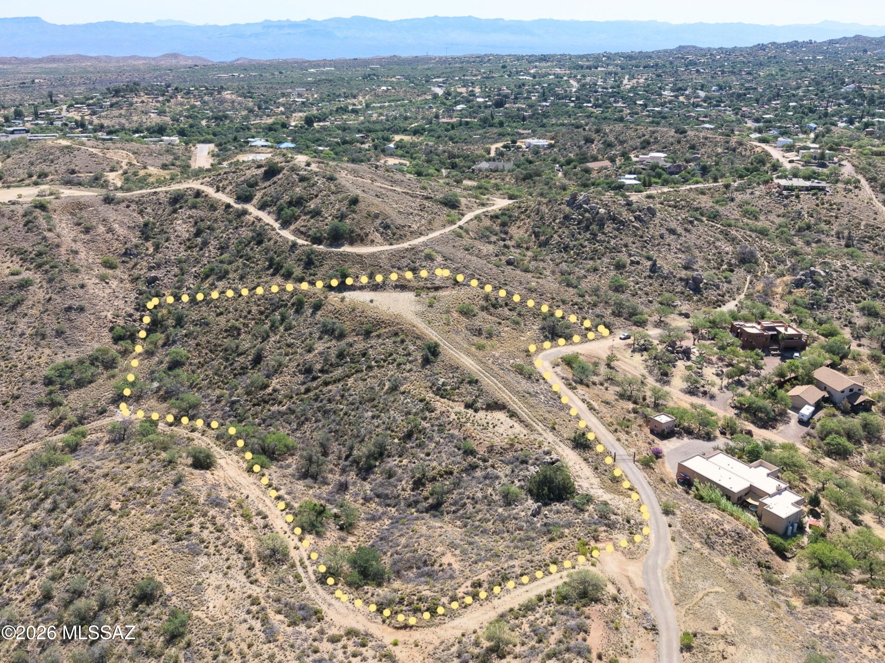 Private 5.05-acre parcel near Oracle in an established rural area of large homes and open desert (APN 308-19-070H, Pinal County). Elevated hilltop setting, roughly 4,480 to 4,560 ft, with mountain foothill views and scattered granite boulders. Zoned CR-2 Single Residence: conventional one-family dwelling, accessory buildings, home occupation, and limited horses/livestock (min. one commercial acre per animal group). Tiny homes allowed if site-built; mobile homes, camping, and RV dwelling not permitted. No flood zone, no wetlands, full acreage usable. Access via recorded 30-ft ingress/egress/utility easement; no interior road built yet, buyer to verify access and plan pad. Electric/water/gas nearby, septic required. No HOA located. Cash purchase.