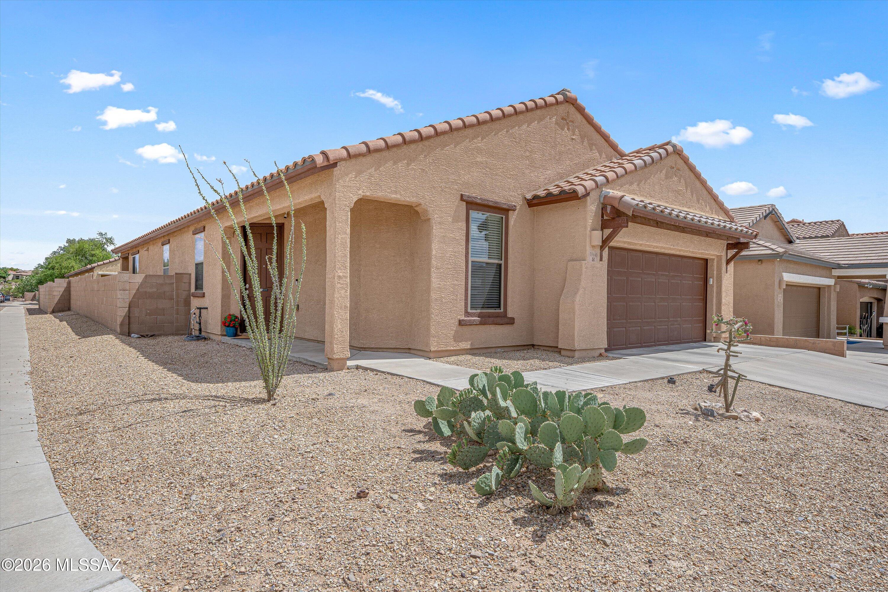 Situated on a premium corner lot in a popular vail golf community w/pool, playground & basketball court. Recently  upgraded home has versatile Gr8 Rm,  plan 3 bed Rms. 2 baths, plus an expansive flex room that works perfectly as an office, den, or game room & could easily convert to a 4th bedroom.
The kitchen is a cooks dream w/granite countertops ,Lrg. center island, stainless appliances, ample storage & dining area that opens to a professionally landscaped rear yard. Enjoy  AZ outdoor living  complete w/artificial turf, paver accents &  a custom fire pit, ideal for relaxing yet minimal  maintenance. Additional features include ceramic tile in all main rooms, newer carpet in bedrooms, a dedicated laundry room.  One of Rancho Del Lago's most popular plans with flexible room functions.
The primary suite offers a private bath retreat w/ a designer tile   step-in shower, stylish executive-height dual sink vanity, & quartz countertop. A large  walk-in closet adds functionality & added storage. Both bathrooms have been eloquently appointed with custom vanities & designer light fixtures.