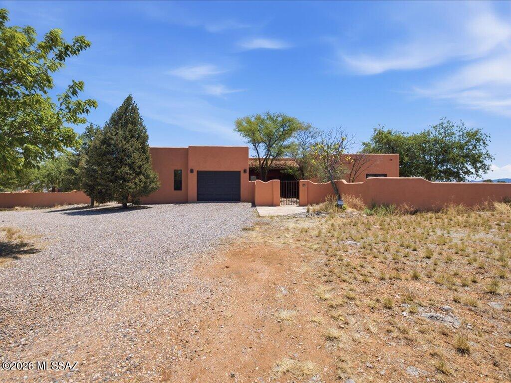 Spacious Santa Fe home in a quiet neighborhood. 5,000' elevation, high-desert grasslands & oak trees, minutes away from town center, wineries, Nat'l Forest and so much more. Home features 3 Bdr & 2 bonus rooms, one of the bonus rooms can be made into private guest quarters or used for extra income as a rental, Primary suite is very spacious w/walk-in closet, new windows, engineered wood floors & newly remodeled Bath. Ceramic tile throughout main house, High ceilings, Kitchen Island, tile countertops, SS appliances, & lots of extra storage, pantry, & huge laundry room. Outbuilding can be made into a guest house, A 1,200 Sf detached Garage/Shop, 6.3 kW Solar system, it powers the whole house to keep electric bills very low! New steel fencing for horses or farm animals, Come see this gem!