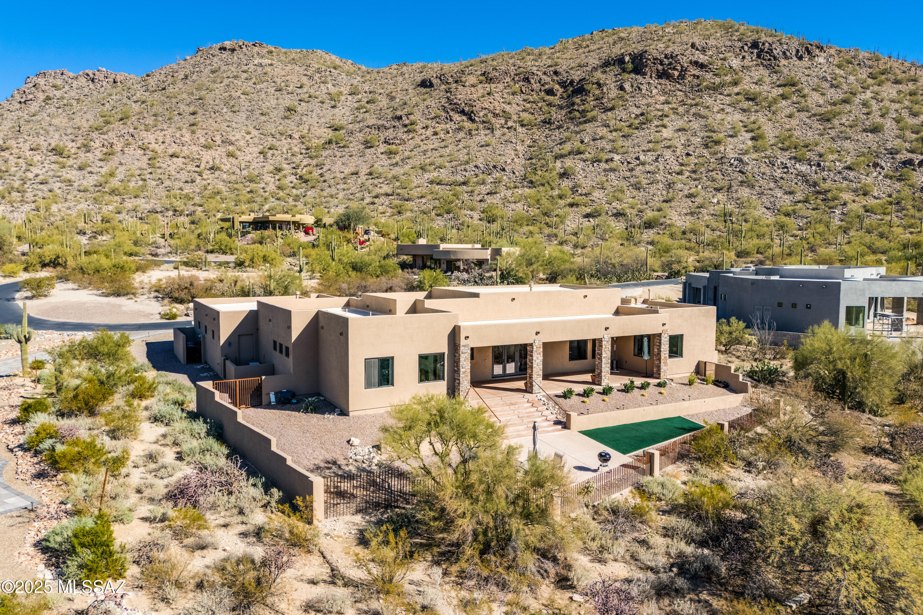2023 Custom home sitting on over half an acre located in The Gallery Golf Club, resides in the sought-after Solana gated community overlooking the 17th fairway. Residence captures breathtaking panoramic desert mountain views throughout. A light-filled kitchen serves as the heart of the home featuring a hand crafted plaster range hood, white oak cabinetry and expansive granite counters. Nearby golf courses, walking paths, and hiking trails complete the experience for an active lifestyle. Information for golf membership to the Golf Club at Dove Mountain available. Don't miss this rare opportunity to own a luxury desert escape in Dove Mountain.