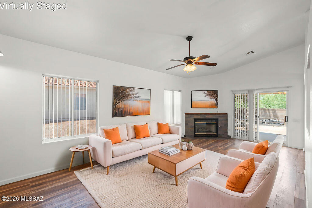 Discover your private desert oasis in this pristine ONE Owner 3-bedroom, 2-bathroom residence that perfectly balances modern comfort with practical, high-value upgrades. Situated on a unique lot that offers exceptional privacy-with no neighbors directly behind and extra breathing room to one side-this home invites you in with soaring vaulted ceilings and a bright, functional layout featuring a dedicated study nook and a versatile cubby space for effortless organization. The home has been freshly updated with new flooring and paint, creating a clean, move-in-ready atmosphere, while significant improvements like upgraded insulation, solar-tinted windows, and a pre-wired surround sound system elevate your daily living experience. The kitchen is ready for your culinary adventures with solid counters, a stainless steel gas cooktop, and appliances all less than 5 years old. Enjoy true peace of mind with a 1-year-old water heater, an AC unit with two years of transferable warranty remaining, and an auto-shutoff system for the main water line. Further convenience abounds with custom garage cabinetry, interior laundry hookups, and a cozy gas fireplace for chilly desert nights. Step outside to your private retreat, where the backyard is fully prepped for entertaining with a dedicated gas line and electric outlets, all while overlooking the serene, unobstructed beauty of the natural Arizona desert.