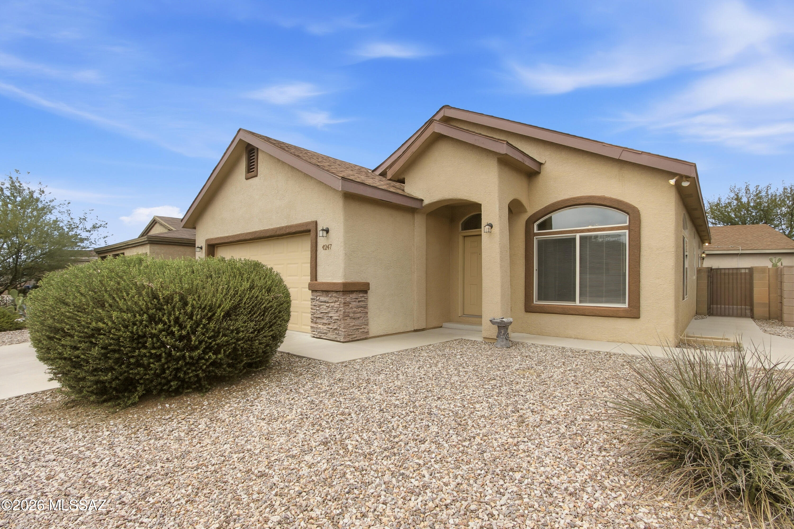 Dining, shopping, and everyday convenience are just minutes away in this move-in ready home with quick access to I-10 and Tucson International Airport! 

Located in the desirable Desert Vista Estates this property offers a functional layout designed for comfortable living and entertaining.
Inside, you'll find wood-look tile flooring, arched architectural details, and an inviting living space filled with natural light. The kitchen features warm wood cabinetry, ample counter space, recessed lighting, a pantry, center island with breakfast bar seating, and direct access to the backyard.

The spacious primary suite includes a private ensuite bathroom with dual sinks, a separate tub and shower, and a walk-in closet.

Make it yours today!!