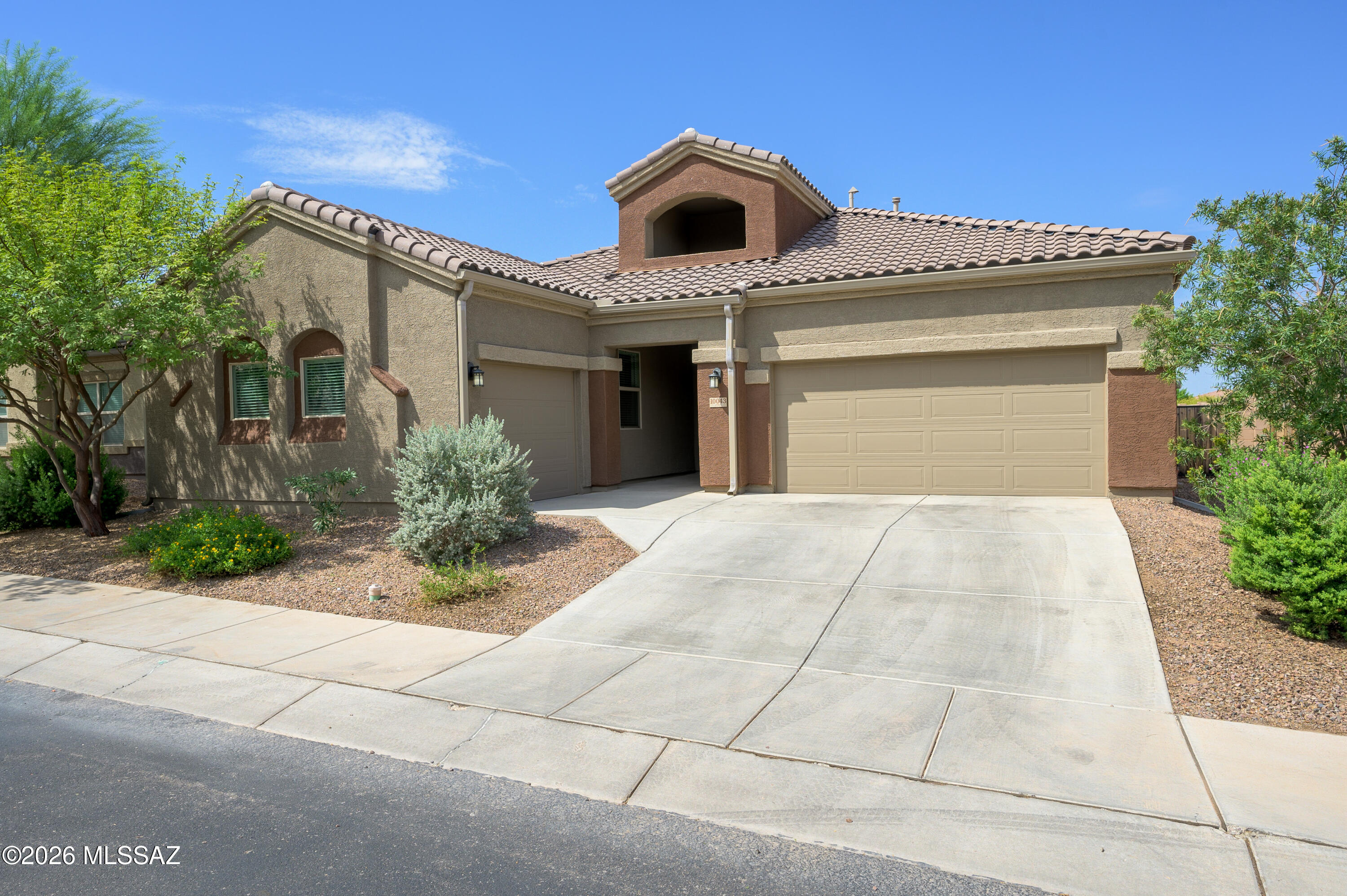 Located in the sought after Saguaro Bloom community, this home is one you need to see in person. From the moment you walk through the front door, you're welcomed by soaring 16 foot ceilings, an abundance of natural light, and an open floor plan that makes the entire home feel bright and inviting. This home has been exceptionally well cared for and is packed with thoughtful upgrades throughout. The kitchen is the heart of the home and features quartz countertops, an oversized island, upgraded cabinetry, a beautiful backsplash, a gas cooktop, convection oven, and a spacious walk in pantry that makes both everyday living and entertaining effortless. Need extra space? The bonus den gives you endless possibilities and can easily be used as a home office, playroom, media room, or workout space. The primary retreat features two separate vanities, a walk in shower, and a generous walk in closet. Two of the additional bedrooms are connected by a Jack and Jill bathroom, while the fourth bedroom is perfect for guests or multigenerational living with easy access to the third full bathroom. Even the laundry room was thoughtfully designed with a built in backpack drop zone and an additional storage closet. Outside, you'll find a beautifully landscaped backyard with lush turf that stays green year round and no rear neighbors, giving you extra privacy to relax or entertain. Add in the three car garage, tall ceilings, oversized windows, and the incredible condition of this home, and it's easy to see why this one stands out.