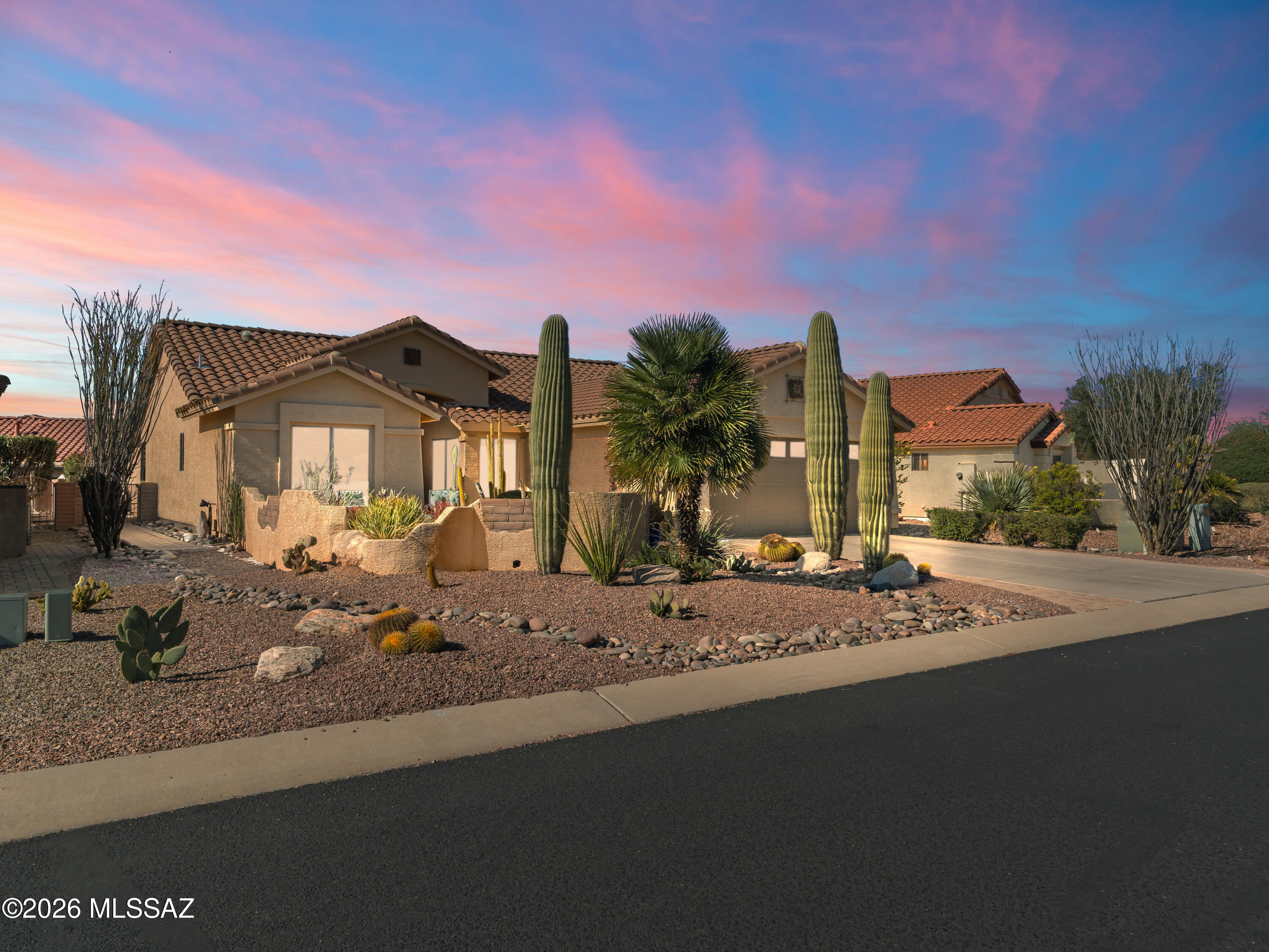 Welcome to Quail Creek Country Club, a premier active adult community offering an exceptional lifestyle and resort-style amenities! This beautifully updated home features a modified Oakmont floor plan with 3 total bedrooms, 3 total bathrooms, a den/office, and an impressive 400+ sq ft attached guest house, perfect for multigenerational living, extended guests, or private overflow space.

Enjoy true Southwest charm from the moment you arrive, with an enclosed front courtyard offering afternoon shade and breathtaking Santa Rita Mountain views. Inside, vaulted ceilings throughout create a bright, open, and spacious feel. The desirable split-bedroom layout includes a comfortable guest bedroom, full hall bath, and a well-appointed den ideal for an office, hobby room, or flexible living space The expansive great room opens seamlessly to the recently updated kitchen featuring newer stainless-steel appliances, quartz countertops, and a timeless tile backsplash, a perfect space for everyday living and entertaining. The primary suite is a peaceful retreat with vaulted ceilings and a spacious en-suite bath with dual vanities, walk-in shower, private water closet, and walk-in closet.

Step outside to the extended covered patio, offering privacy and plenty of room to relax or entertain. Adding to the home's appeal is the private rear access to the attached guest house, thoughtfully designed with classic Southwest character. Inside, you will find a spacious great room with a breakfast bar and kitchenette, accented by warm desert tones and architectural charm. The casita also includes a separate bedroom and full bath, creating a welcoming retreat that feels like its own private desert hideaway.

Located in the highly sought-after Robson Resort Community of Quail Creek, residents enjoy an unmatched lifestyle with championship golf, pickleball and tennis, fitness and pools, walking trails, on-site dining, creative arts, clubs, and endless social opportunities. This is more than a home it is the Quail Creek lifestyle.