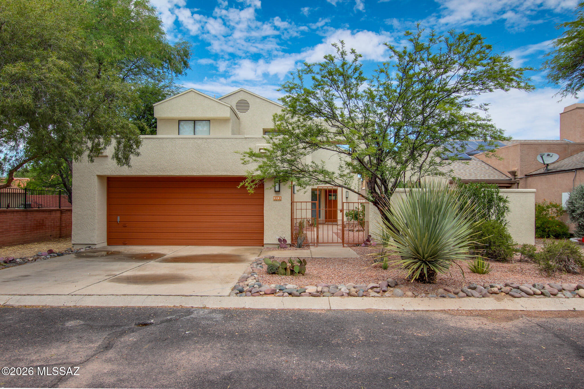 Turnkey and beautifully remodeled, this 3-bedroom, 2.5-bathroom two-story home is located in the highly desirable Old Fort Lowell district. Thoughtfully updated throughout, the home offers modern finishes, stylish design, and move-in ready convenience.

Nestled within Bosque Creek, a unique community of just 72 single-family homes shaded by magnificent mature mesquite trees, residents enjoy a peaceful setting unlike any other in Tucson. Just steps from The Chuck Huckleberry Loop, Tucson's premier walking and biking path, outdoor recreation is right at your doorstep.

Community amenities include a spacious pool and ramada surrounded by a 13-acre privately owned habitat conservation area, creating a true desert oasis. Enjoy scenic walking paths, birdwatching, picnicking, swimming, or sim relaxing in the natural beauty that makes Bosque Creek so special.

Whether you're looking for a full-time residence, seasonal retreat, or low-maintenance lifestyle in a prime central Tucson location, this exceptional home offers the perfect combination of comfort, convenience, and community.