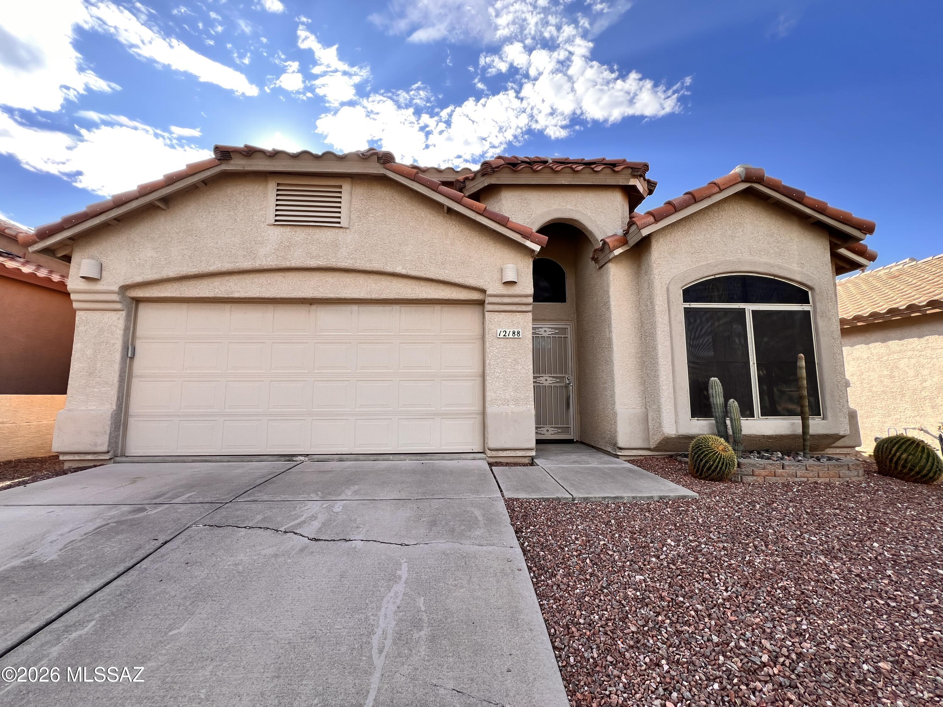 Located in the heart of Oro Valley this 4bdr/2ba is minutes to Oro Valley Marketplace, Oro Valley Hospital, Catalina State Park and more! Open and bright kitchen features gas range, stainless steel appliances, eat-in kitchen nook w/bench seating. Primary bedroom w/ensuite offers dual vanity, garden tub and step in shower. Formal living room, greatroom w/fireplace, split bedroom floorplan, ceiling fans, fenced backyard, two car garage and more!