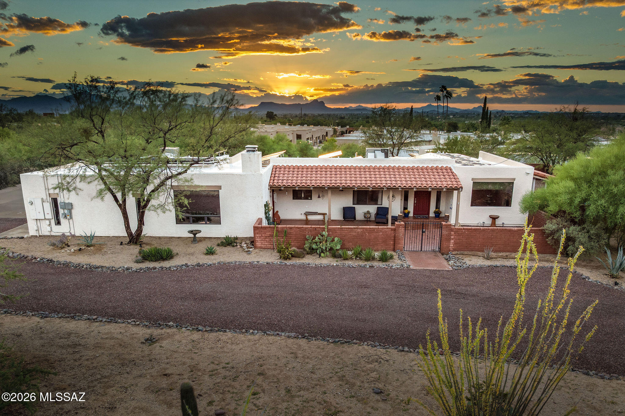 This beautiful home is situated on just under an acre lot, designed to take advantage of the breathtaking Pusch Ridge Mountain Views! Additionally, this property features a 1,069sf guest house with a bedroom, bathroom, living room and a kitchen that is fully equipped for any home! It's perfect for multigenerational living or rental income. No HOA in this desirable neighborhood and lots of room for your RV or toys! 
The charming curb appeal features a circular driveway and a large stunning courtyard that is the perfect place to enjoy the sunrise or relax and enjoy the gorgeous mountain views! 
Inside you have a wonderful floor plan and multiple picturesque views of Pusch Ridge Mountain. Updated bathrooms & kitchen!