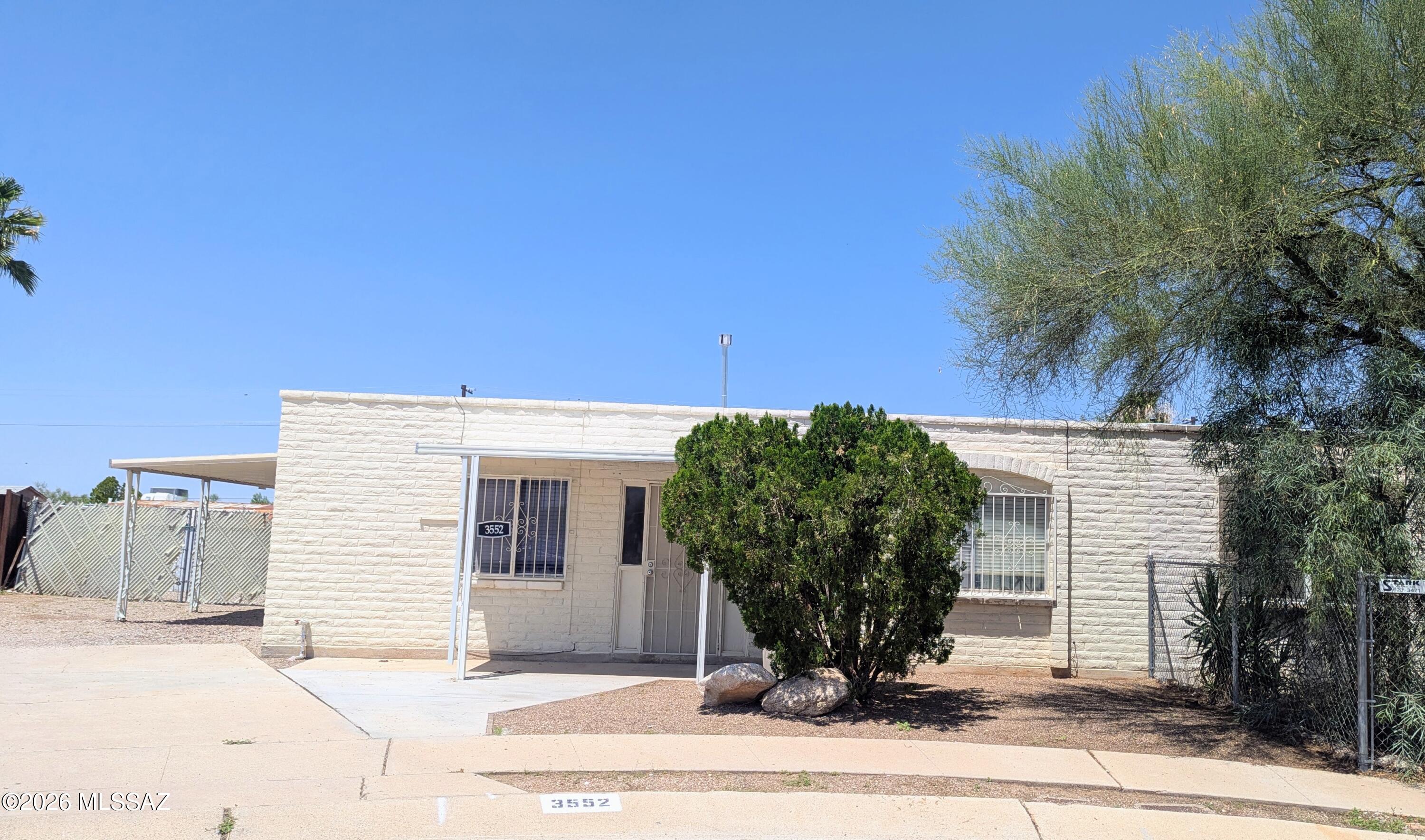 Super cute 2 bedroom townhome situated on a large, fenced lot and move in ready. Located close to DMAFB, schools, and shopping. No carpet, fresh paint, a covered patio, and no there's HOA. Would make a great starter home or investment opportunity.