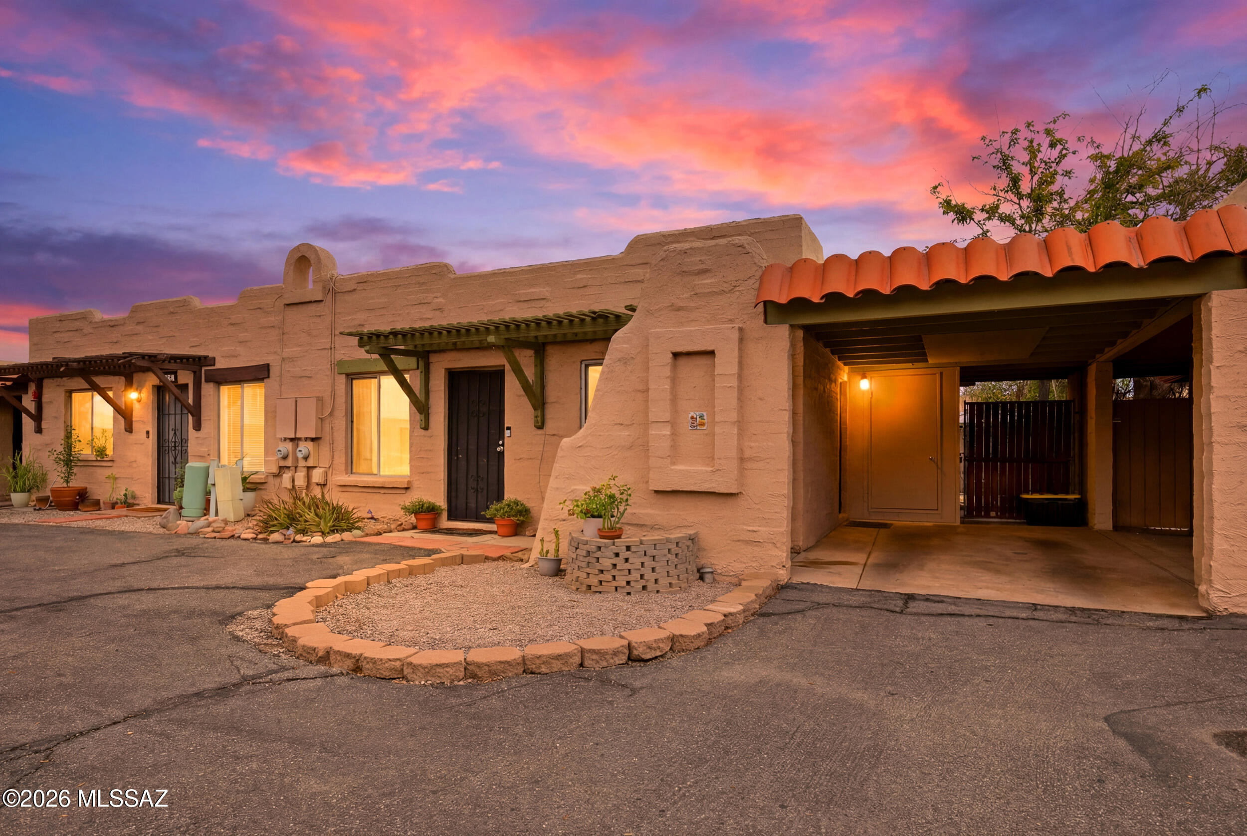 Welcome to this inviting two-bedroom, one-bath townhouse nestled in the heart of central Tucson. Whether you're settling in for the long haul or looking for a comfortable home base, this residence offers the space, privacy, and amenities to make everyday living feel effortless.
Step inside to an airy, open-concept living area where natural light flows freely between the living room, dining space, and kitchen -- ideal for entertaining or simply spreading out after a long day. The thoughtful layout makes the most of every square foot without sacrificing comfort.
Out back, your own private backyard offers a quiet retreat -- perfect for morning coffee, weekend barbecues, or letting pets roam freely. A dedicated carport keeps your vehicle shaded and protected from the Tucson sun and a conveniently located exterior laundry room means clean days are just steps away.
When you're ready to cool off, the community pool is just a short stroll away -- your own private oasis in the desert heat.